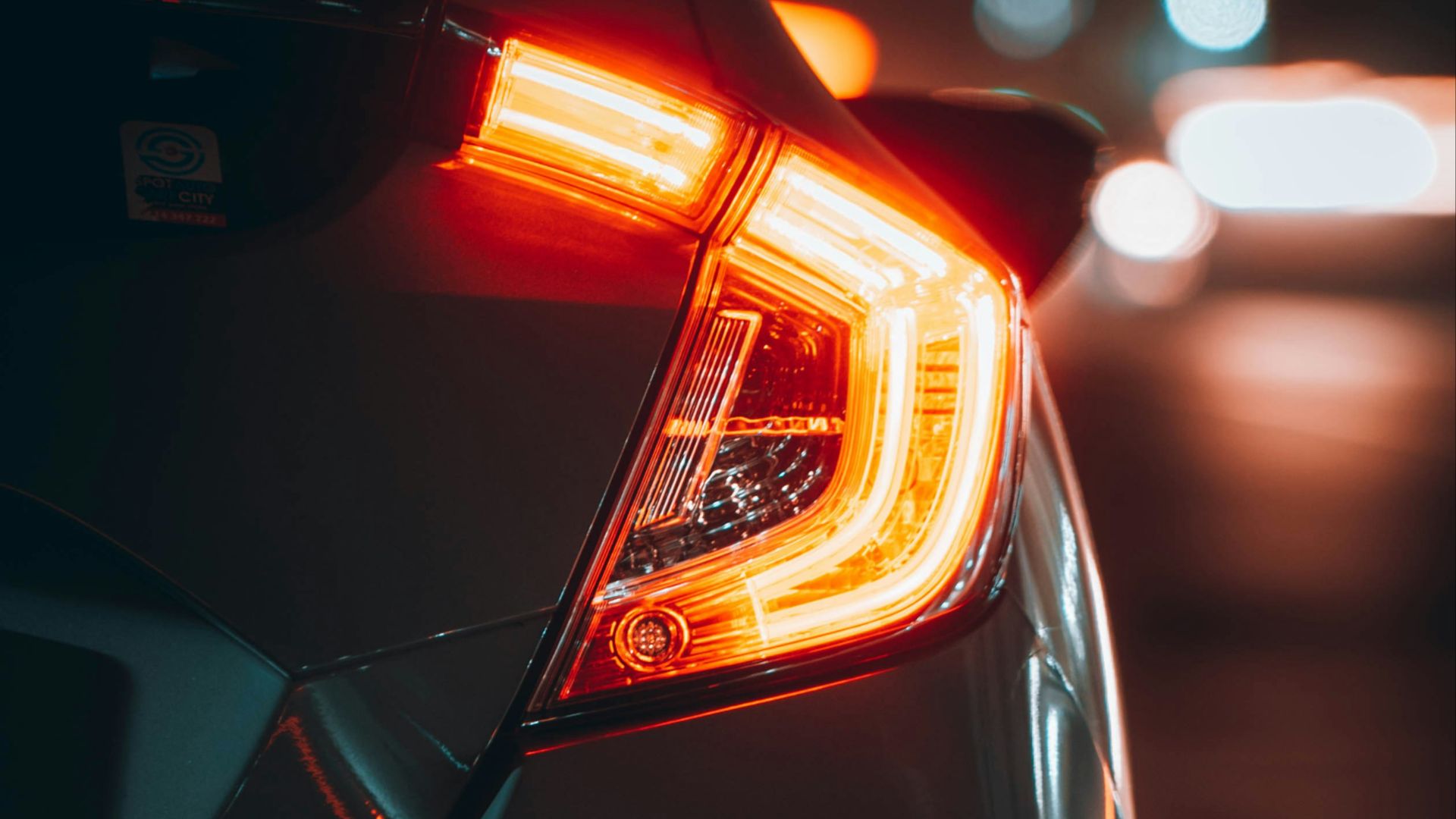 black car with red and yellow lights