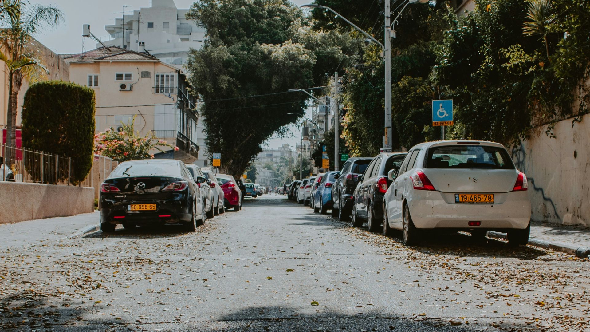 a street with cars parked on both sides of it