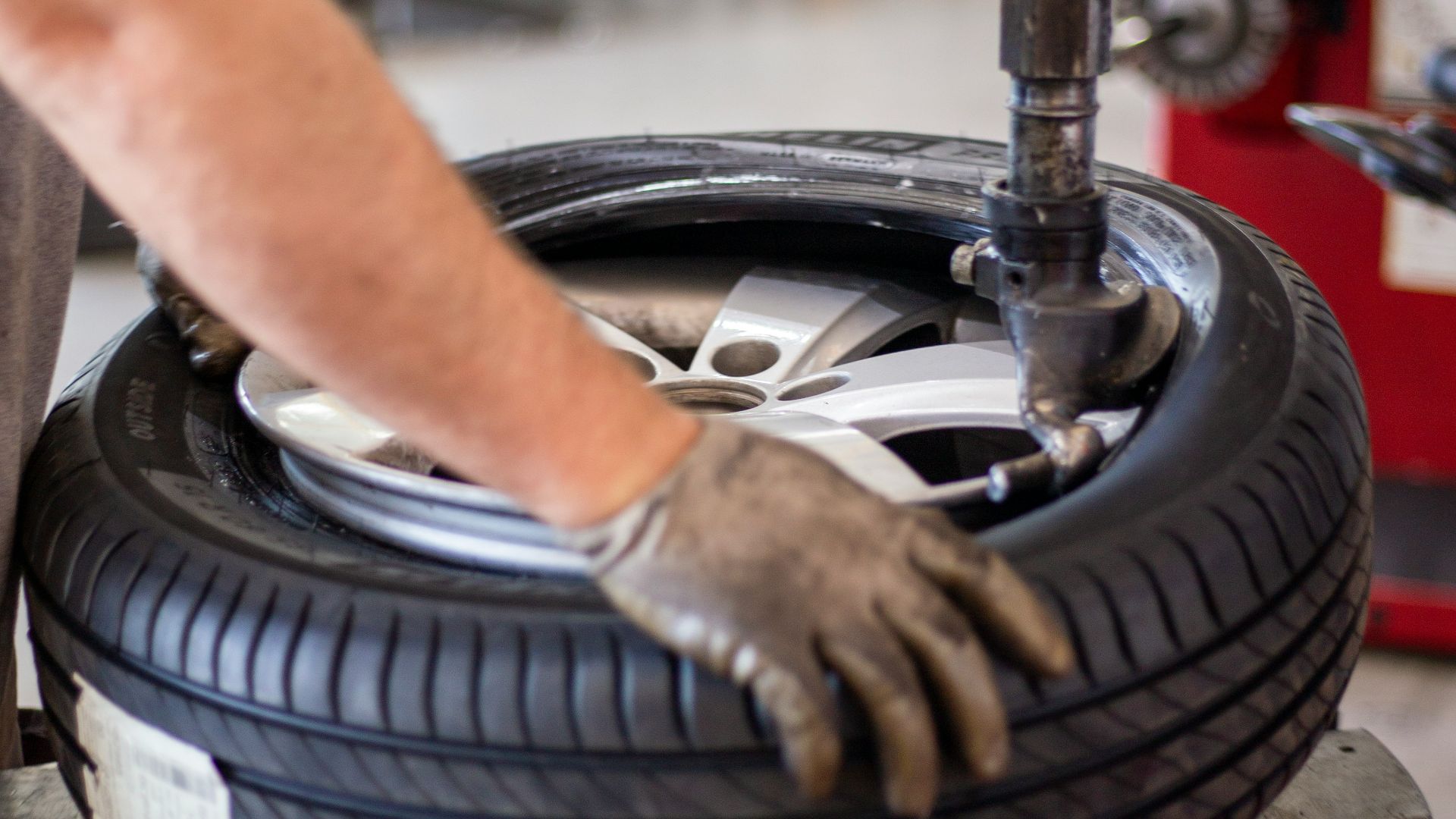 person holding black and gray metal tool