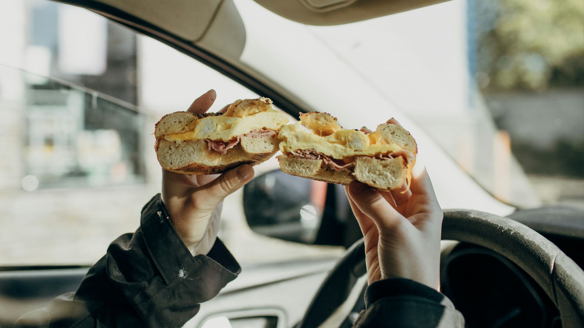 person holding bread with meat