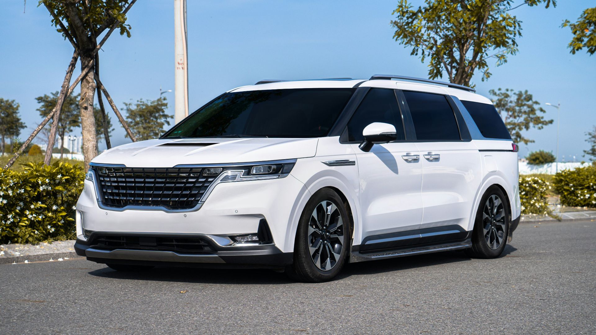 a white suv parked on the side of a road