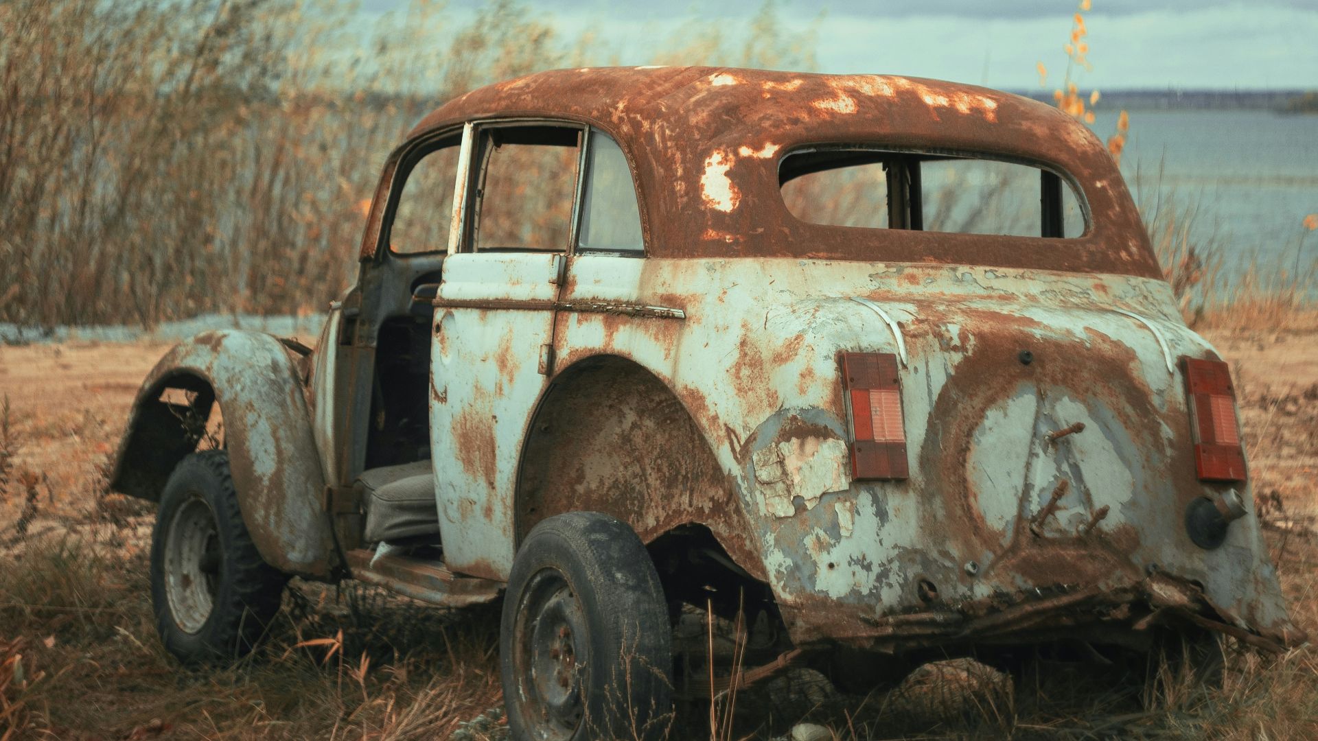 vintage car on brown field during daytime