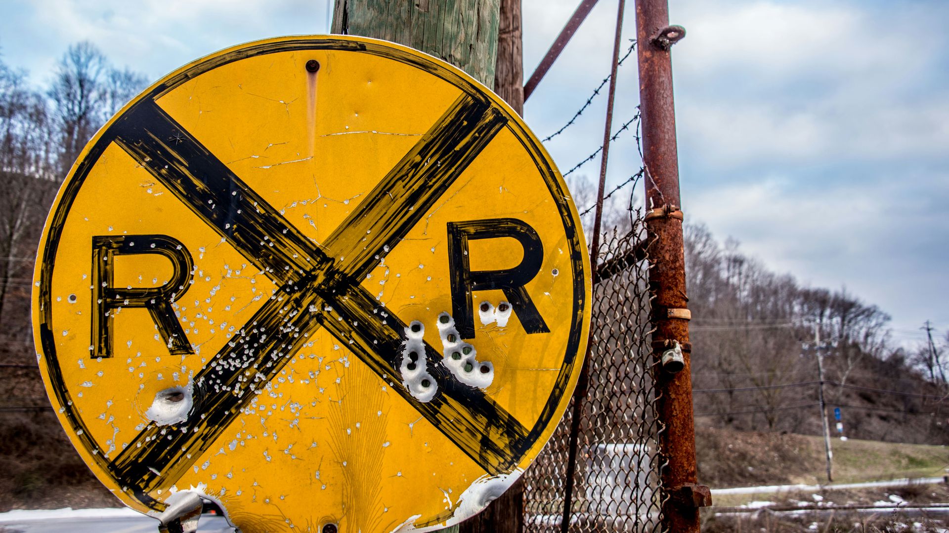 RXR road signage with bullet holes