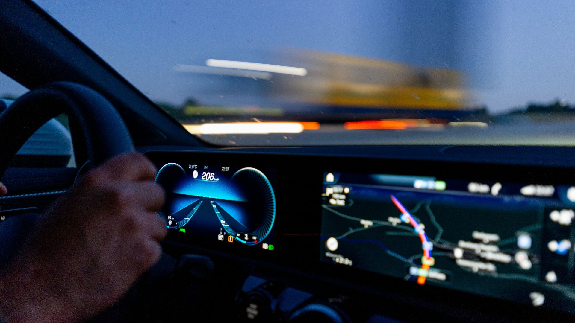 person's hand on steering wheel