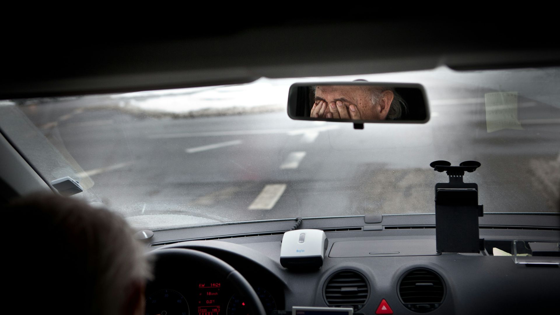 person driving car during daytime
