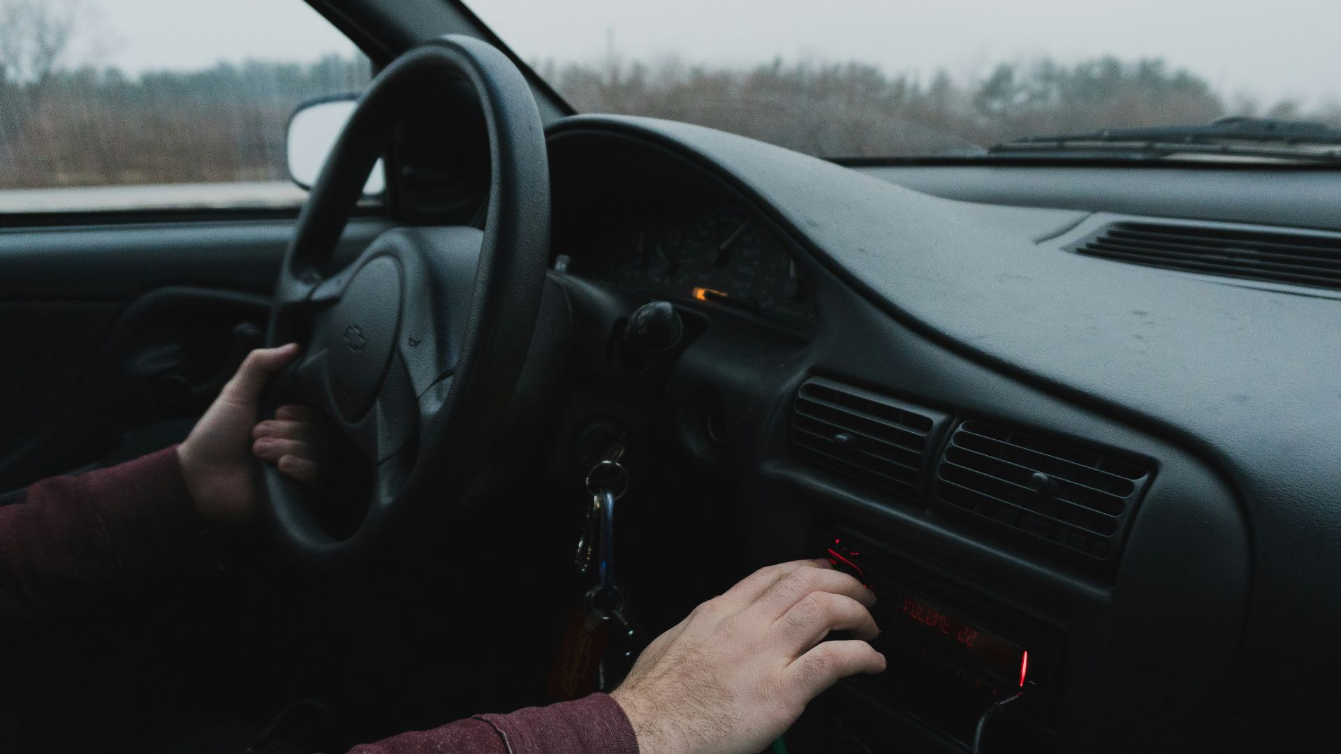 person driving black car