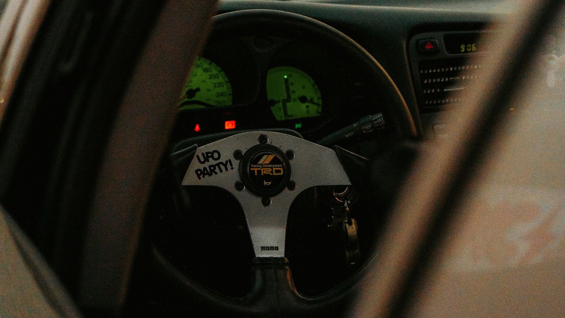 A view of a car's dashboard from the driver's seat