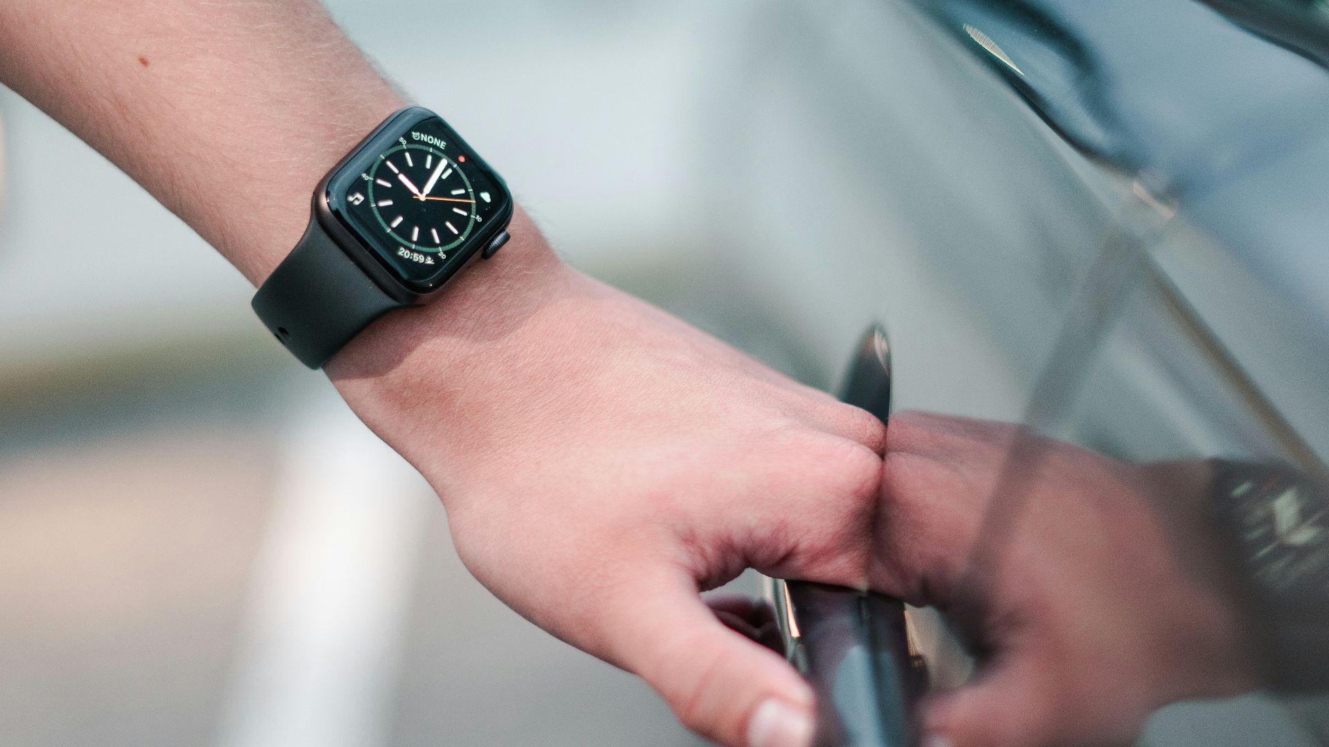 person wearing black digital watch