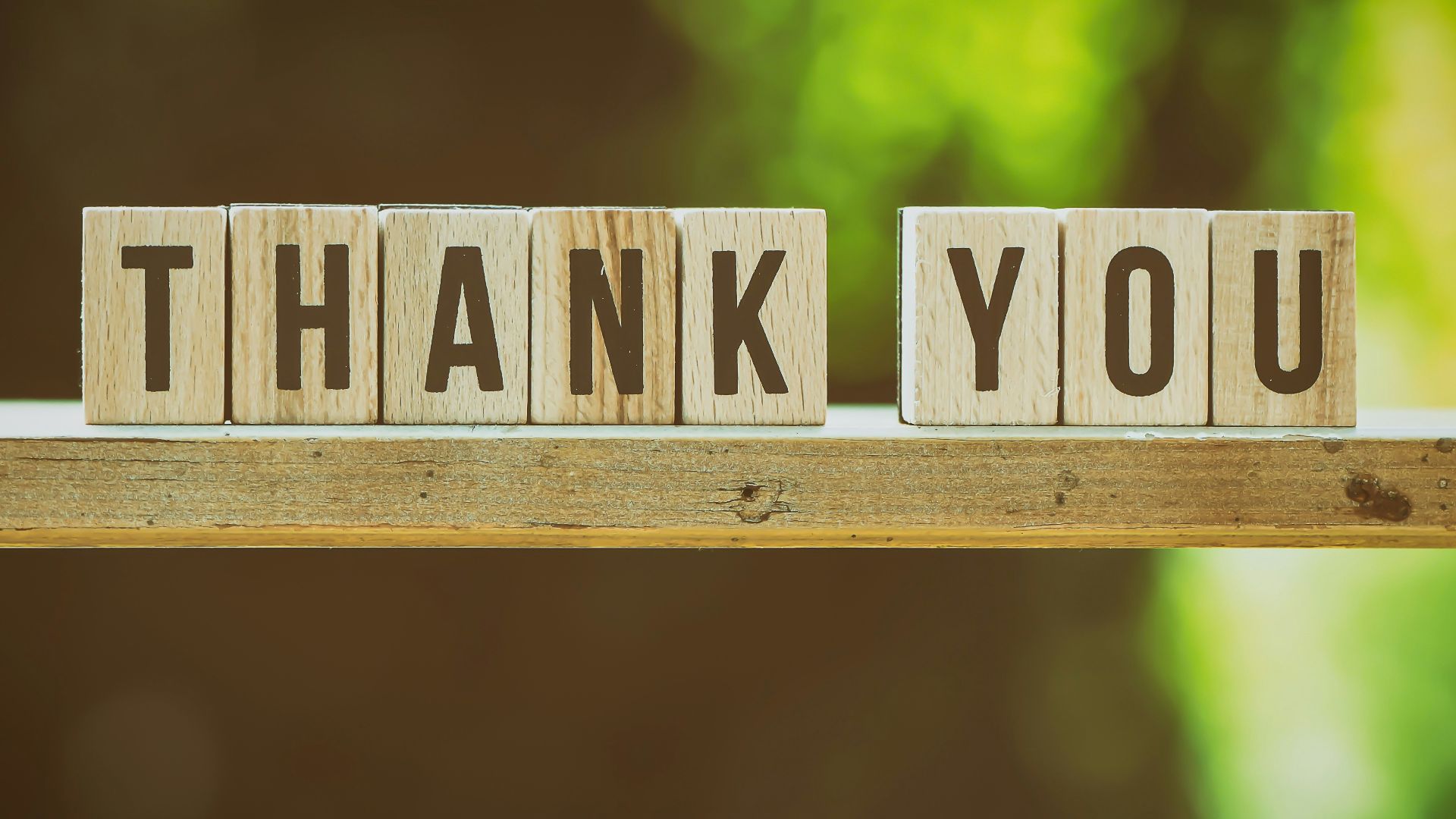 brown and white wooden arrow sign