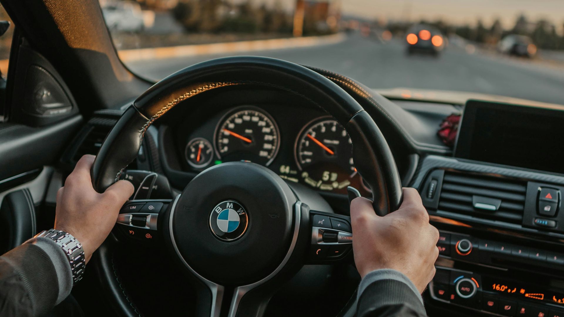 unknown person driving BMW car