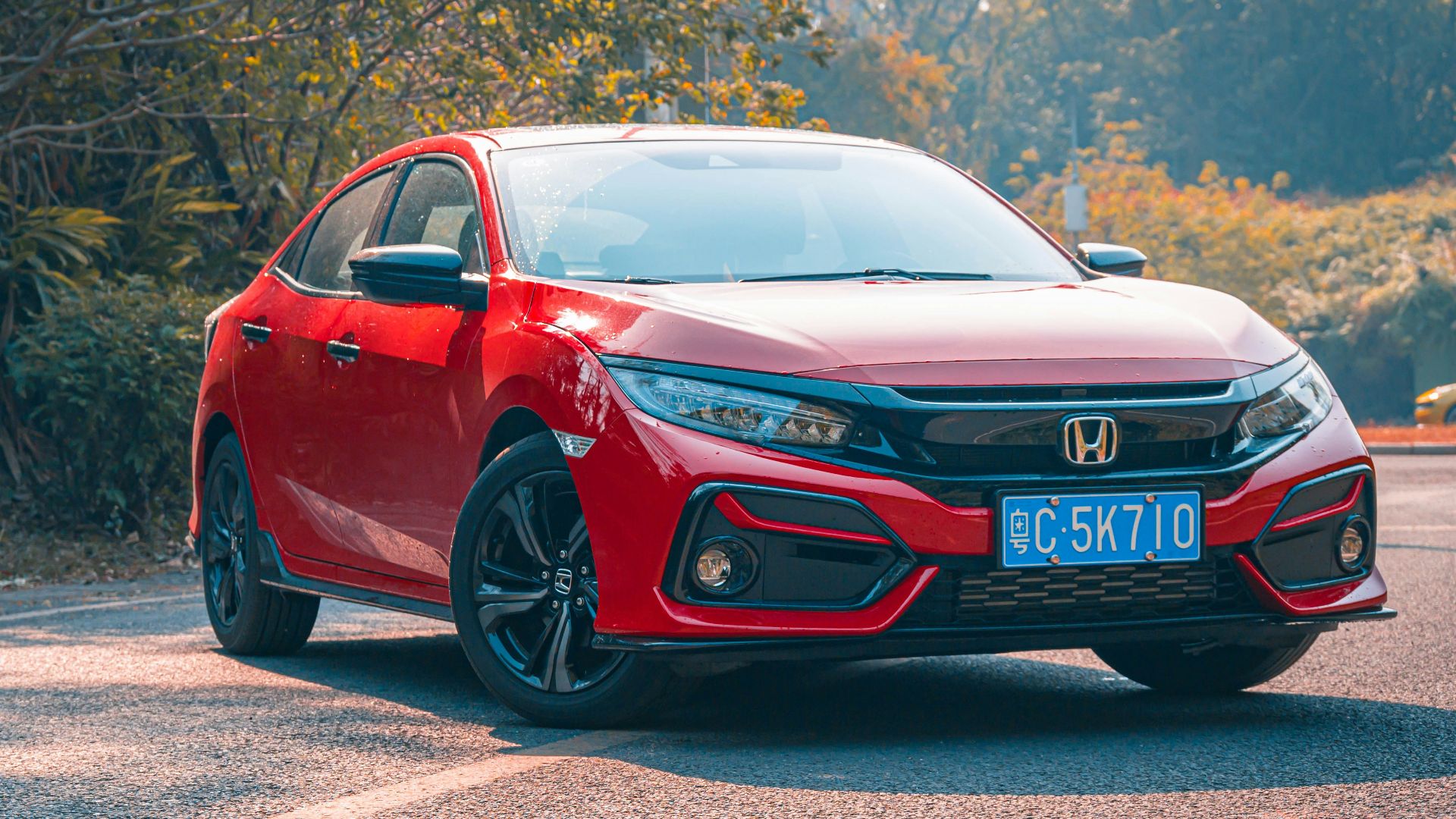 red audi r 8 on road during daytime
