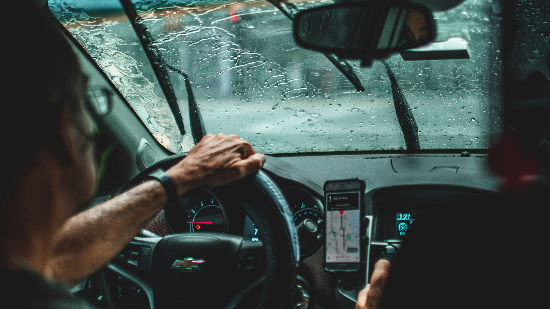 man driving car during daytime