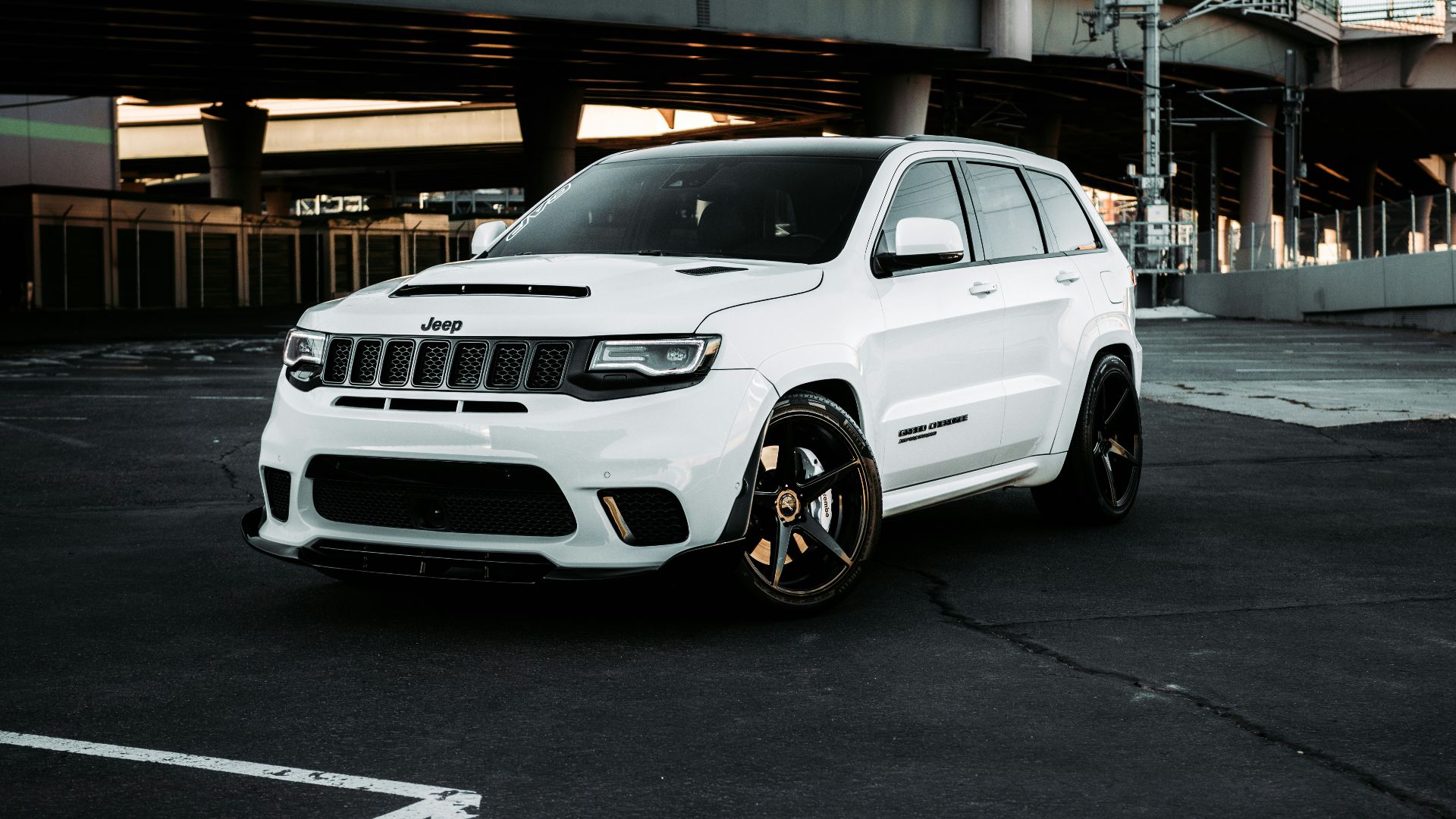 white bmw x 6 parked on parking lot during daytime