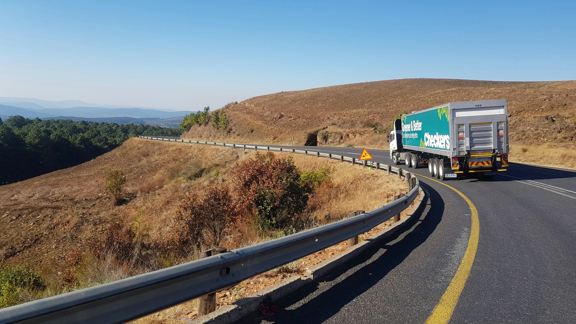 white and blue truck on road during daytime