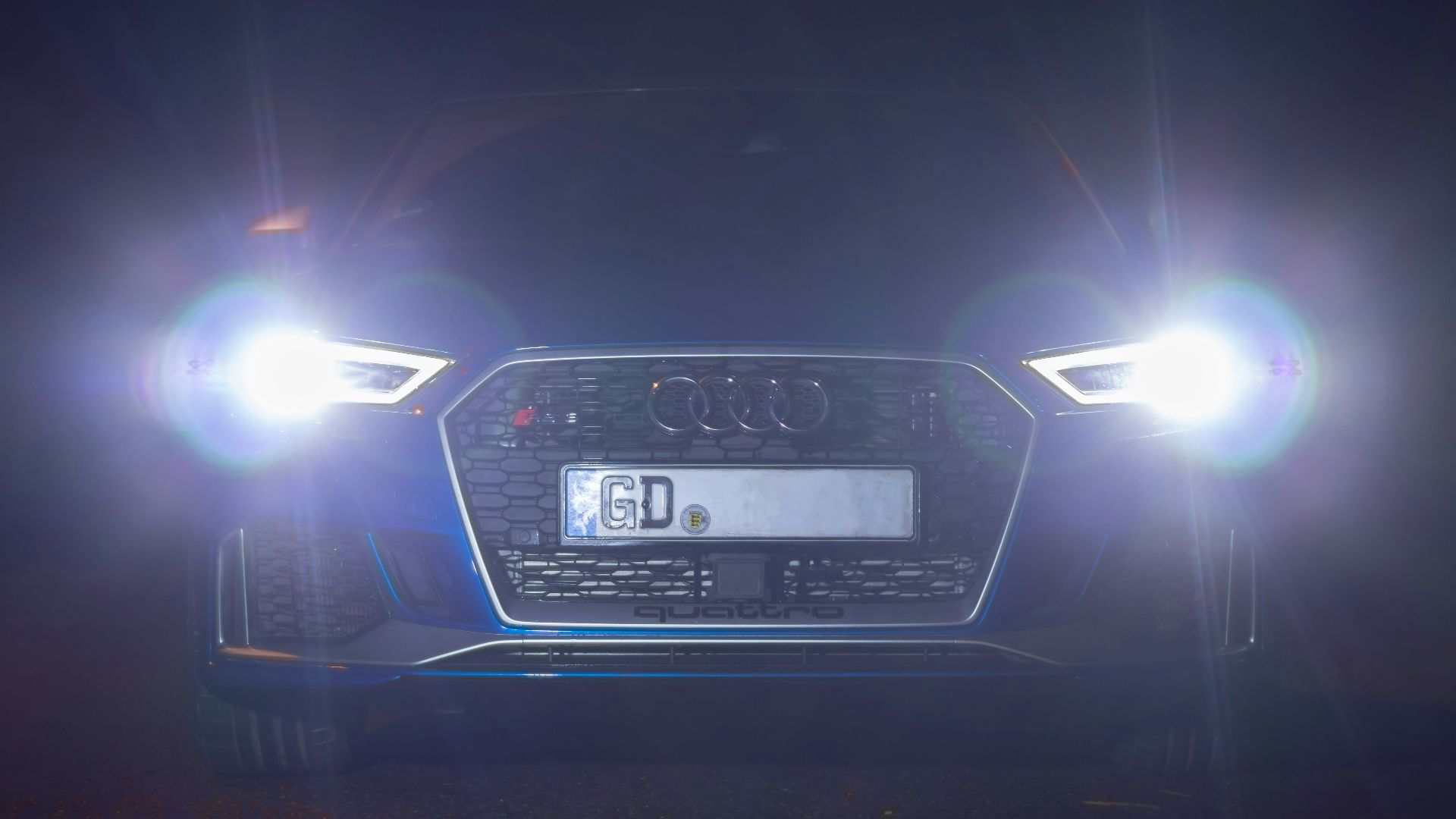 black car on road during night time