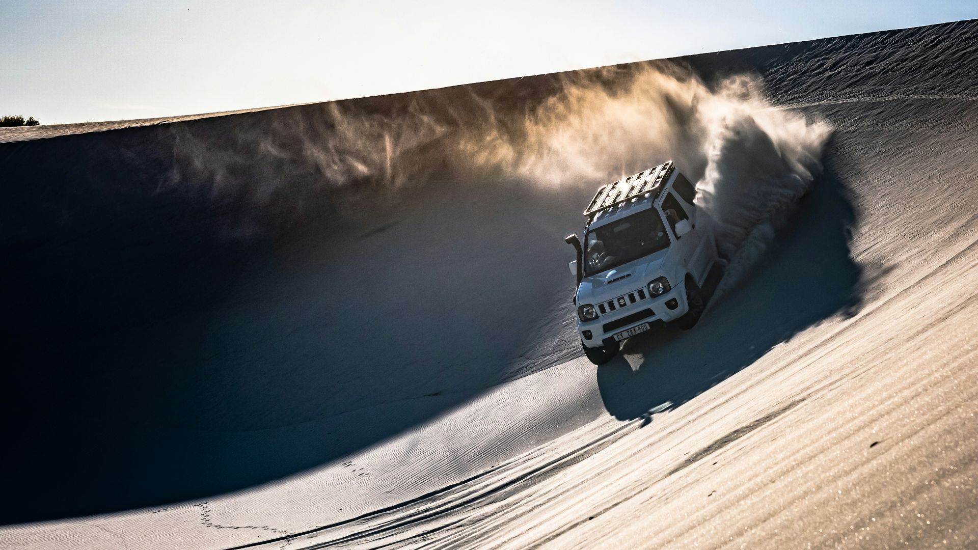 white SUV on desert during daytime