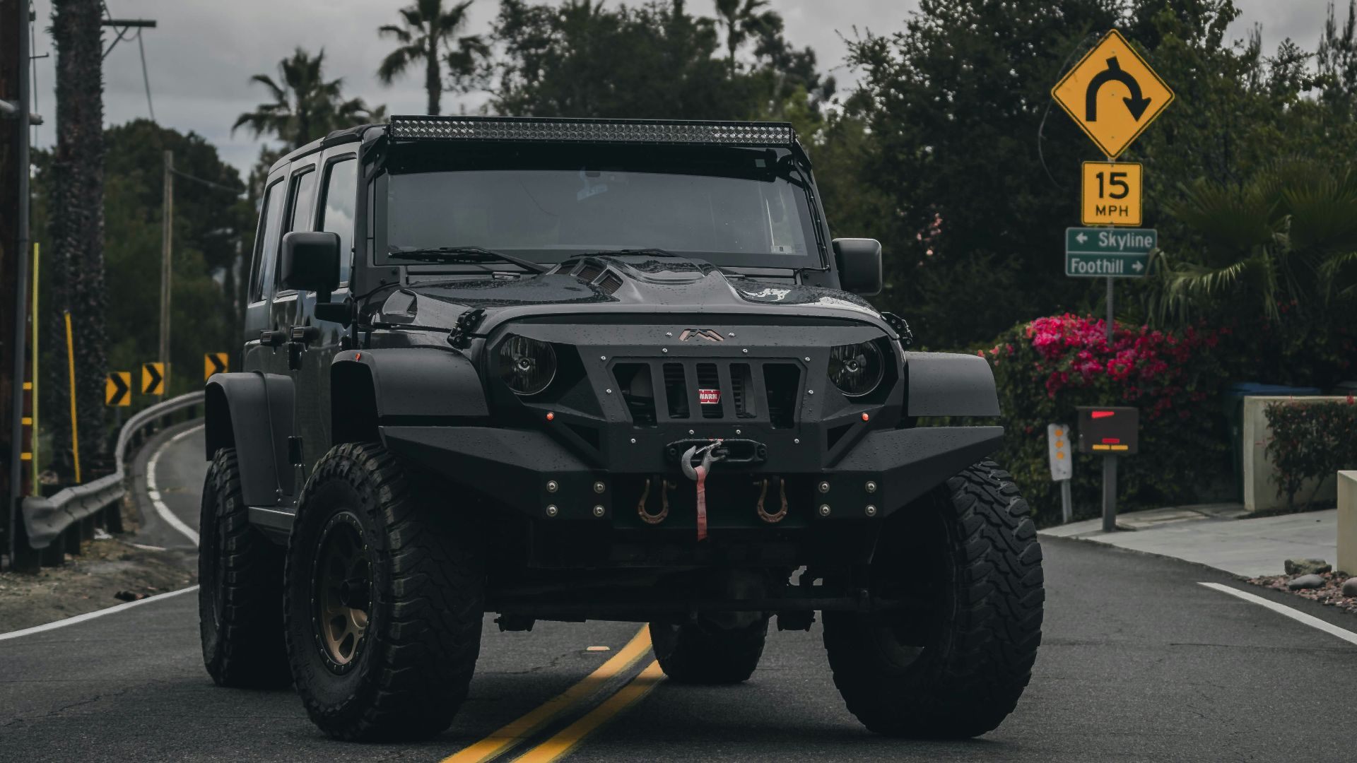 black jeep wrangler on road during daytime