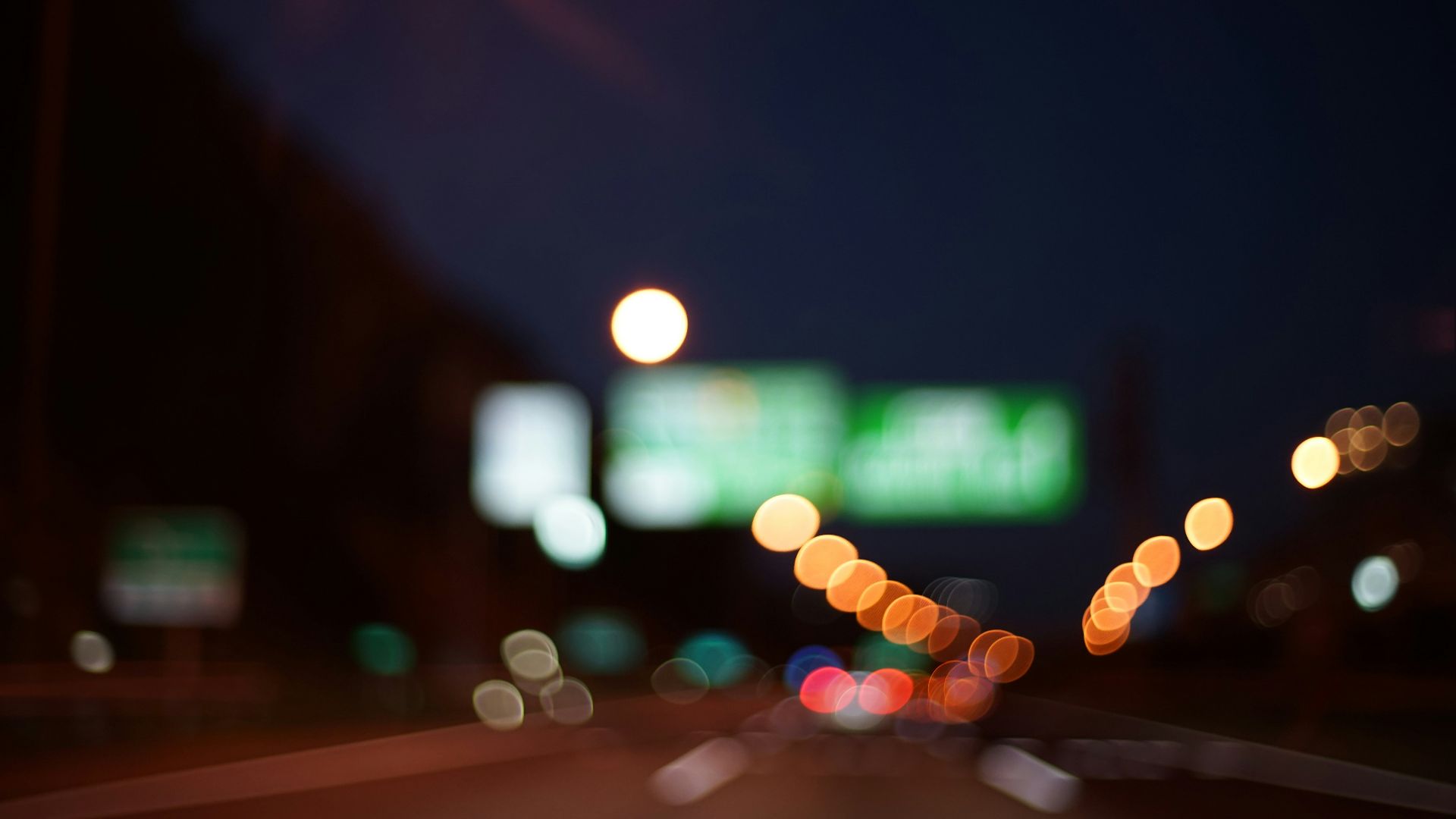 city street with lights during night time