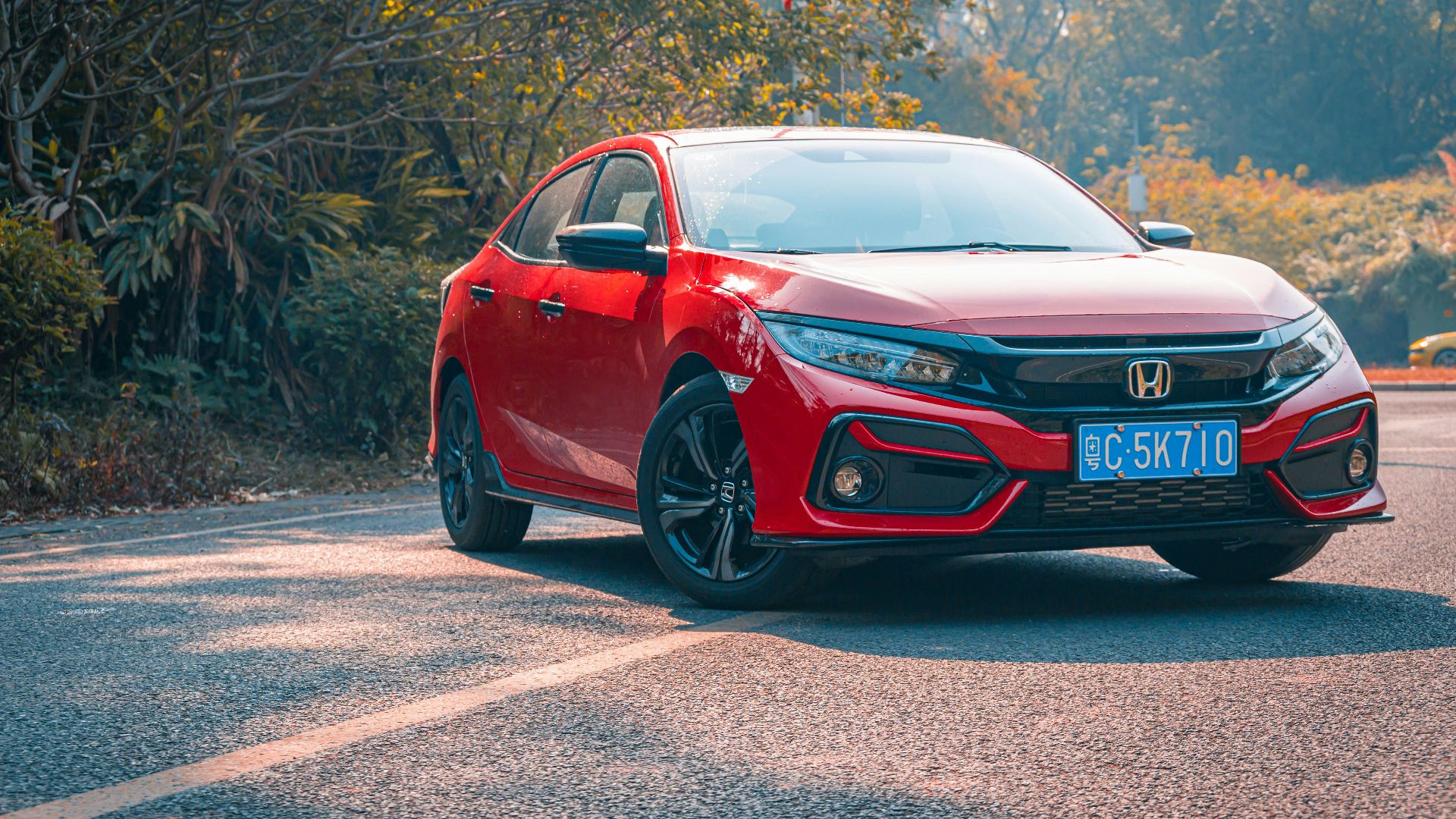 red audi r 8 on road during daytime