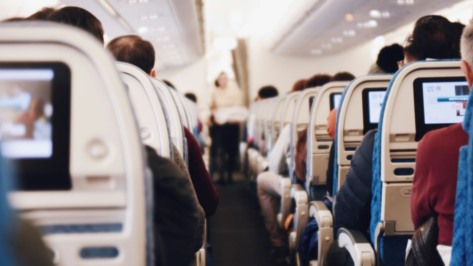 shallow focus photography of people inside of passenger plane