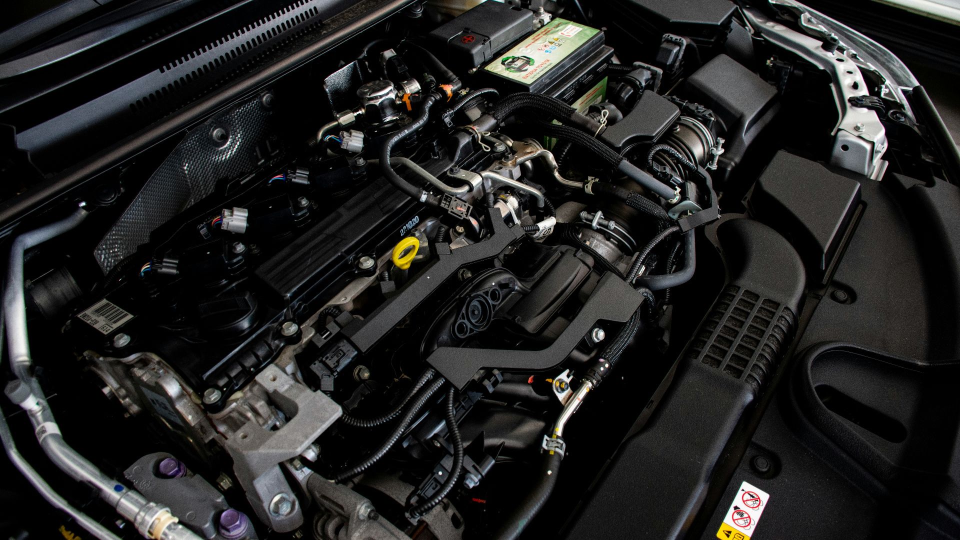 the engine compartment of a car with its hood open