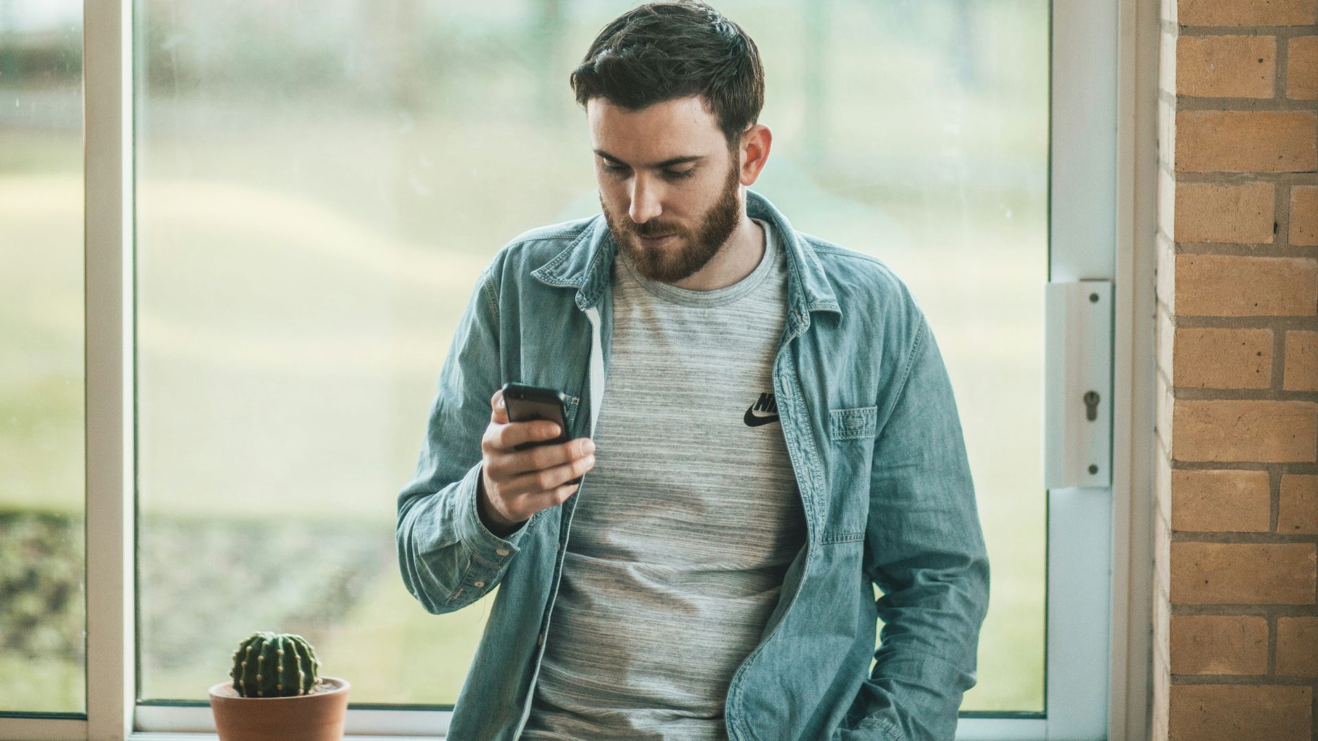 man using his smartphone