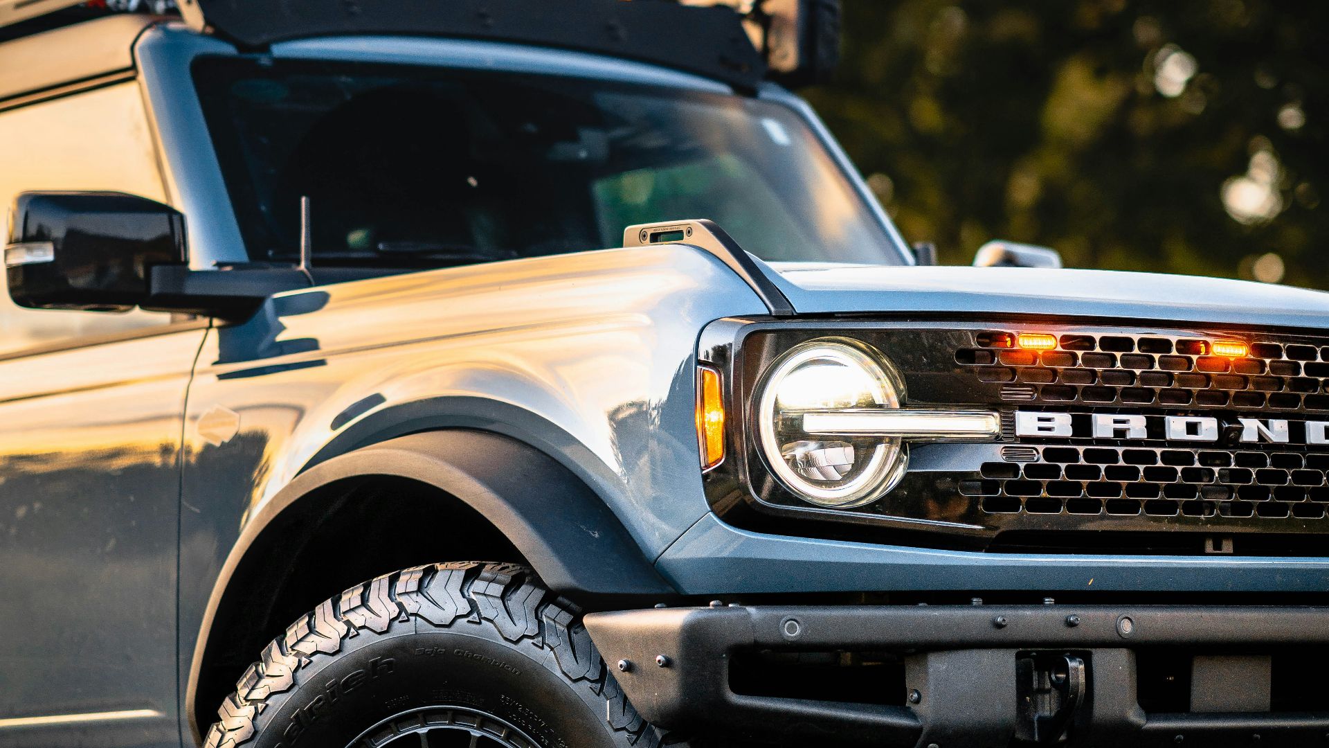 a truck with lights on top of it parked in a parking lot