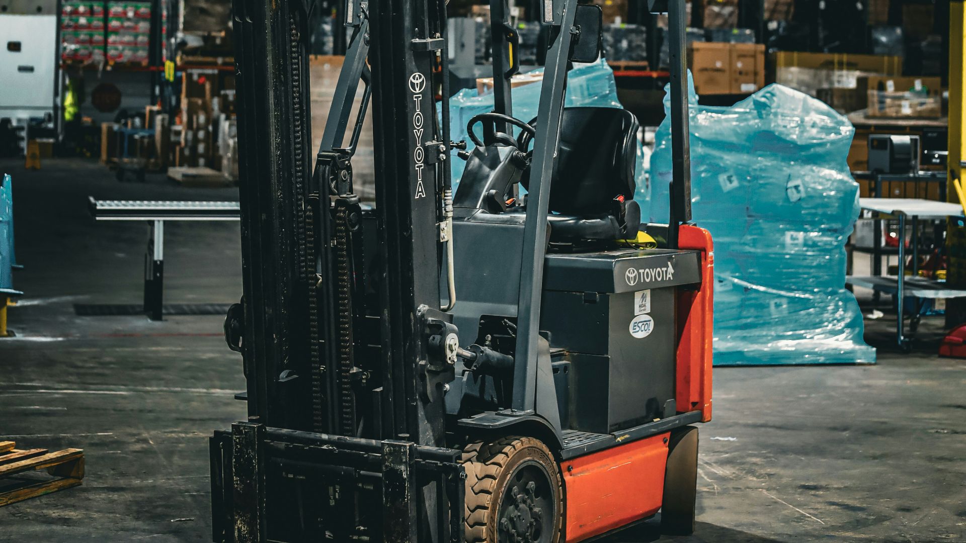 a forklift parked inside of a warehouse