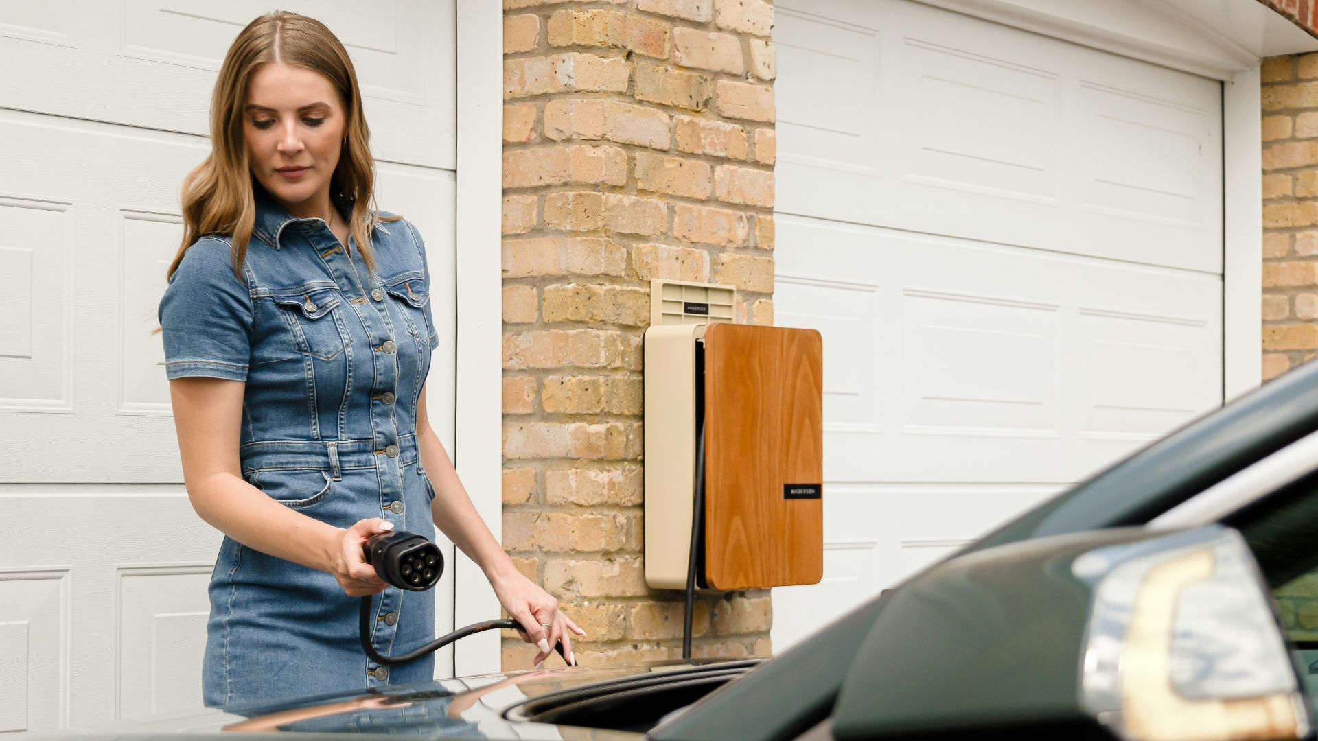 A woman is standing next to a car