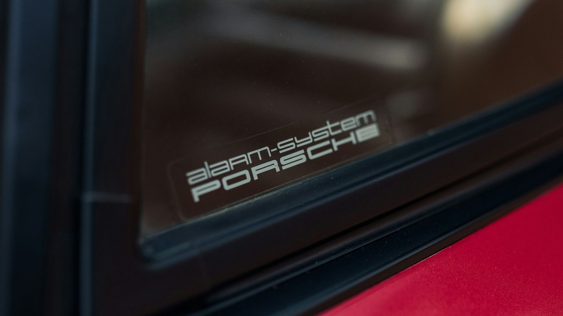 Alarm system porsche sticker on car window