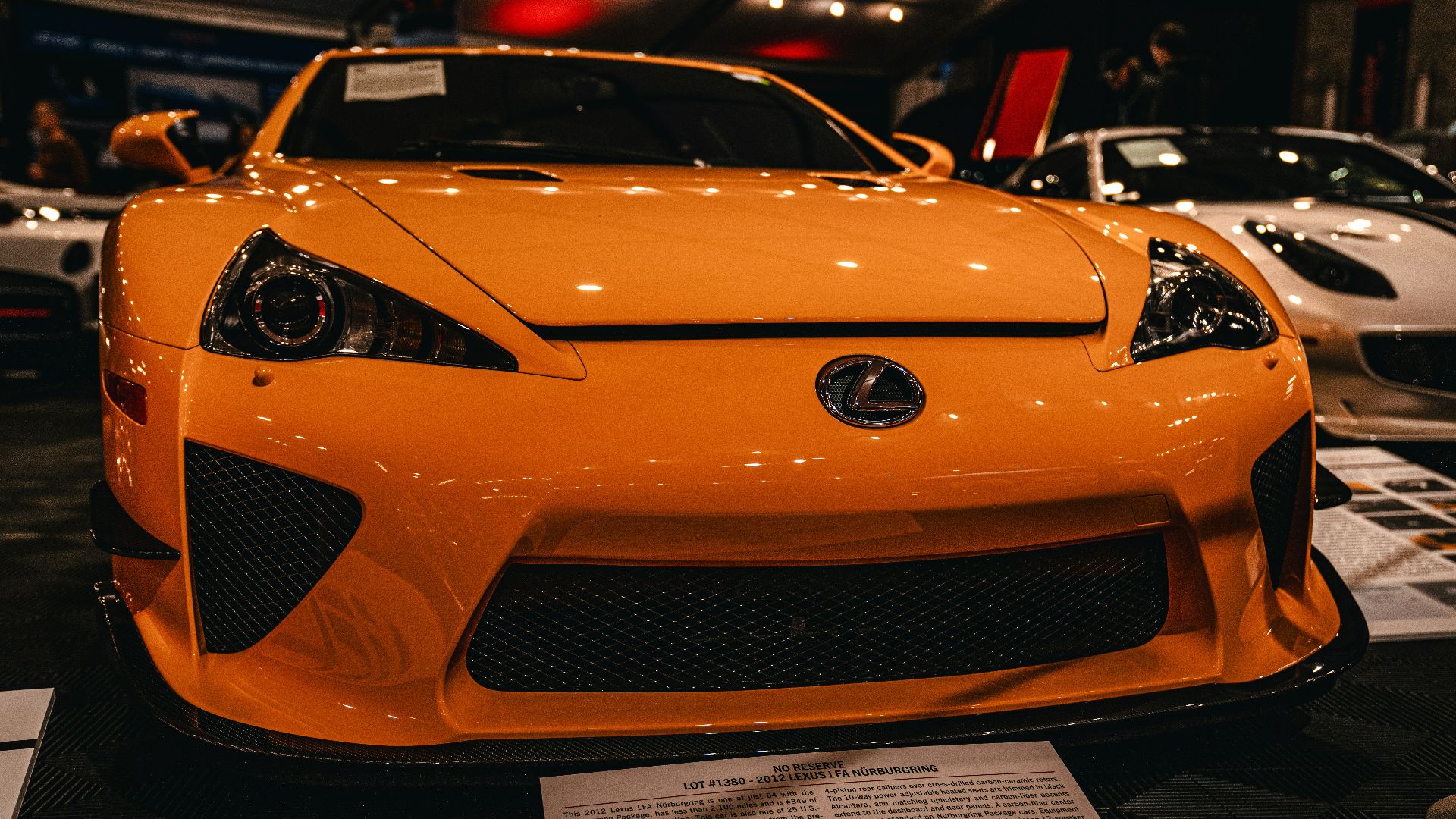 a close up of a car on display at a car show