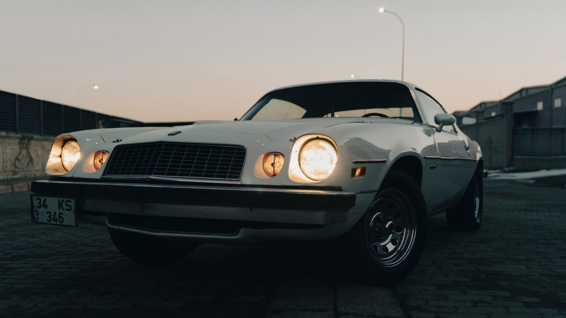 a white car parked in a parking lot