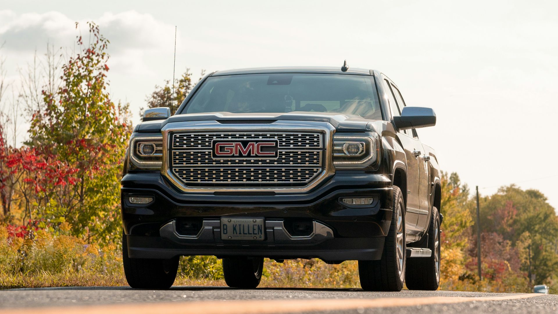 black chevrolet car on road during daytime