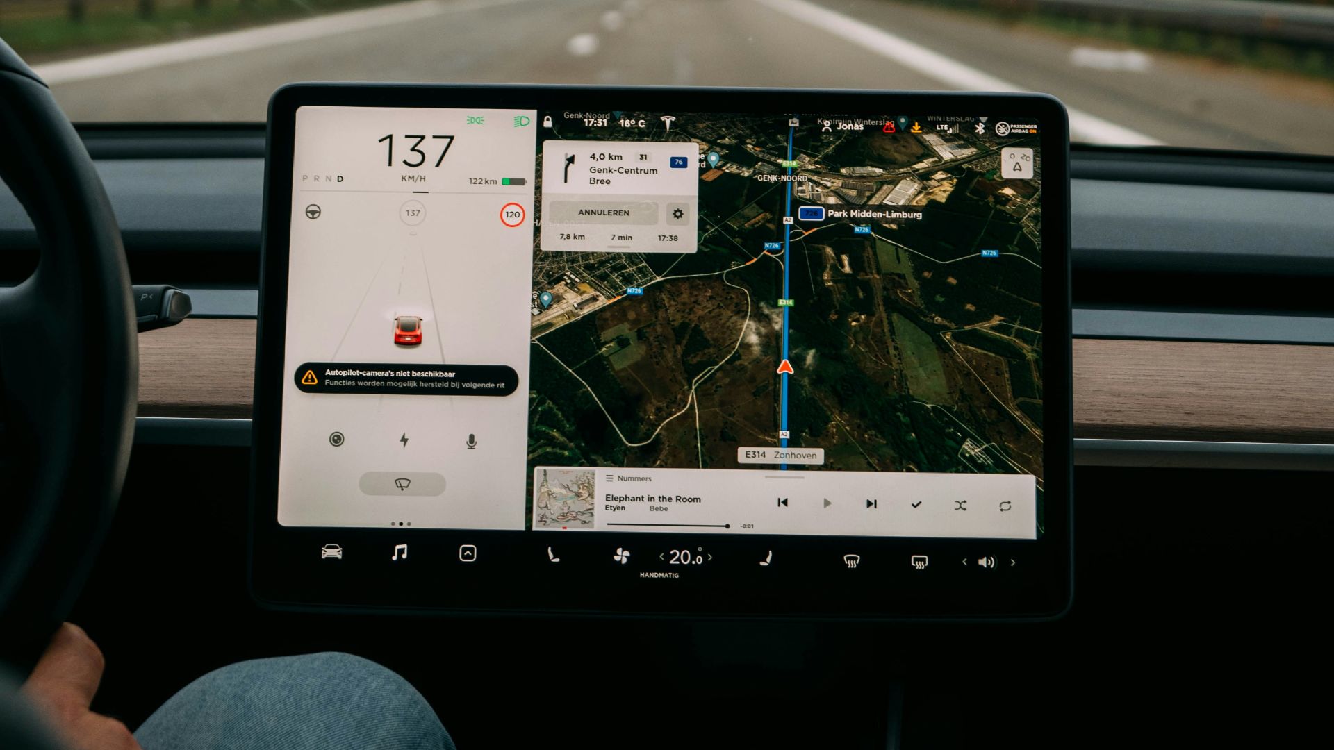 person holding white ipad inside car