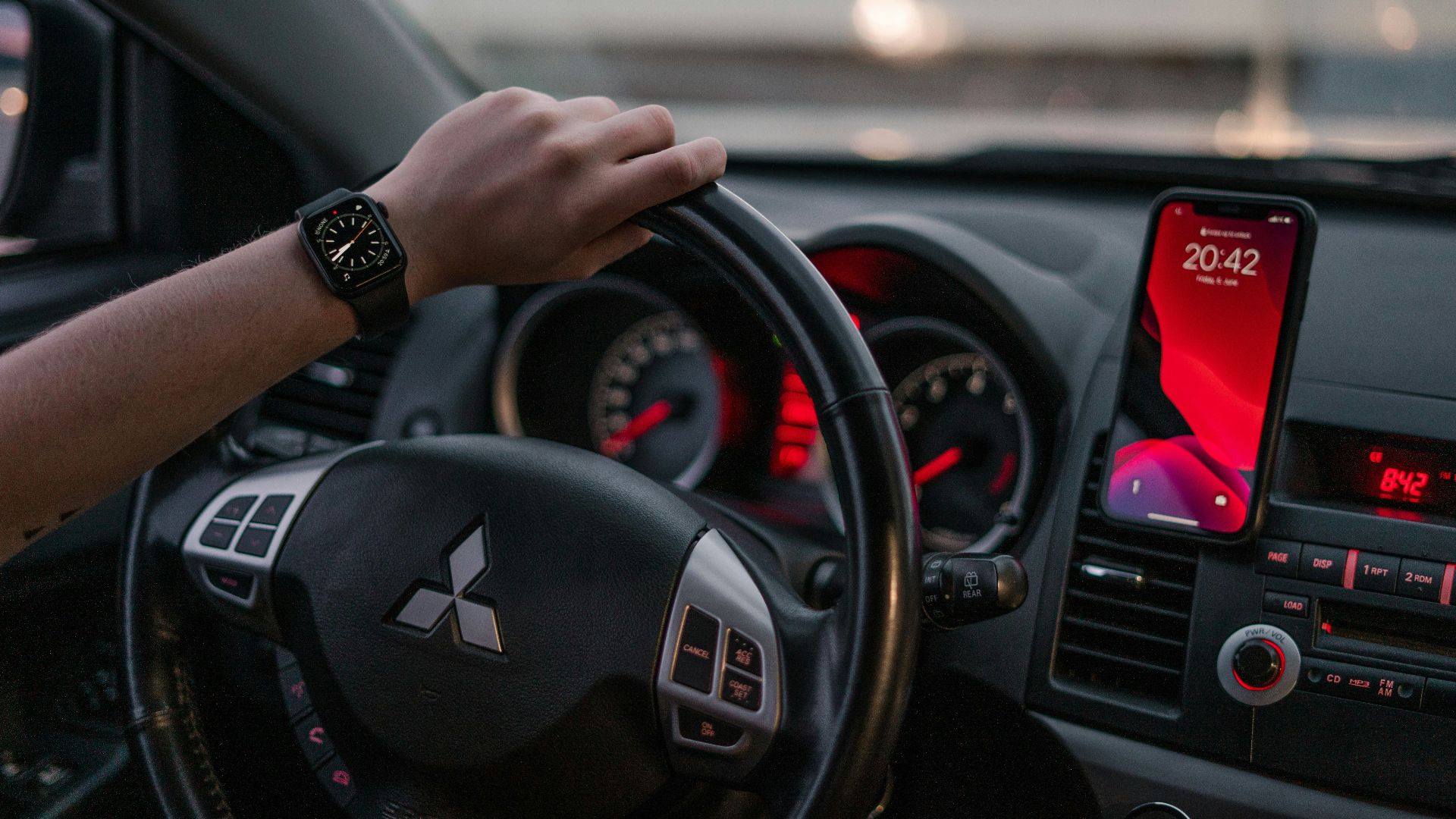 person driving black honda car