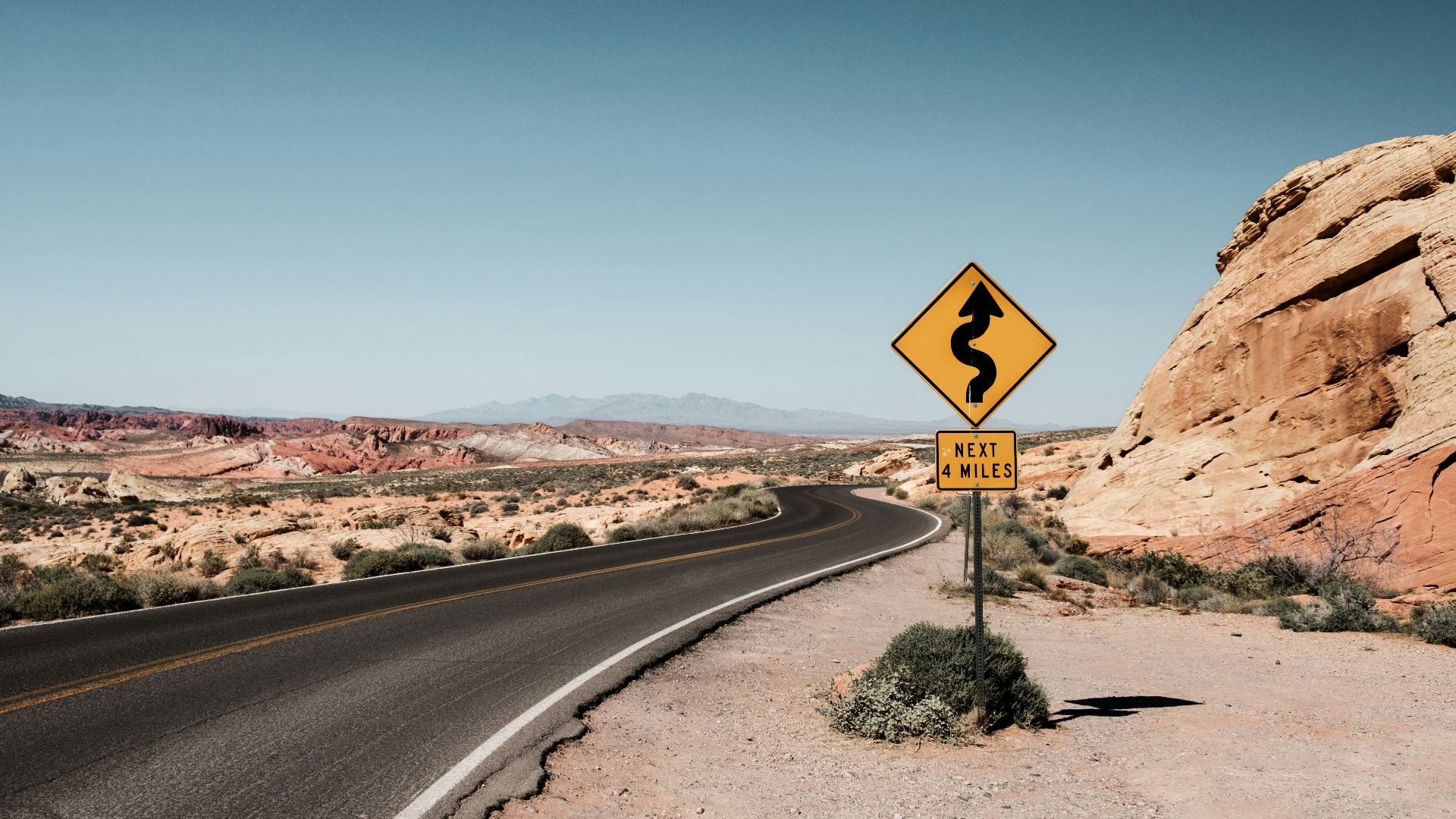 yellow and black zigzag signage