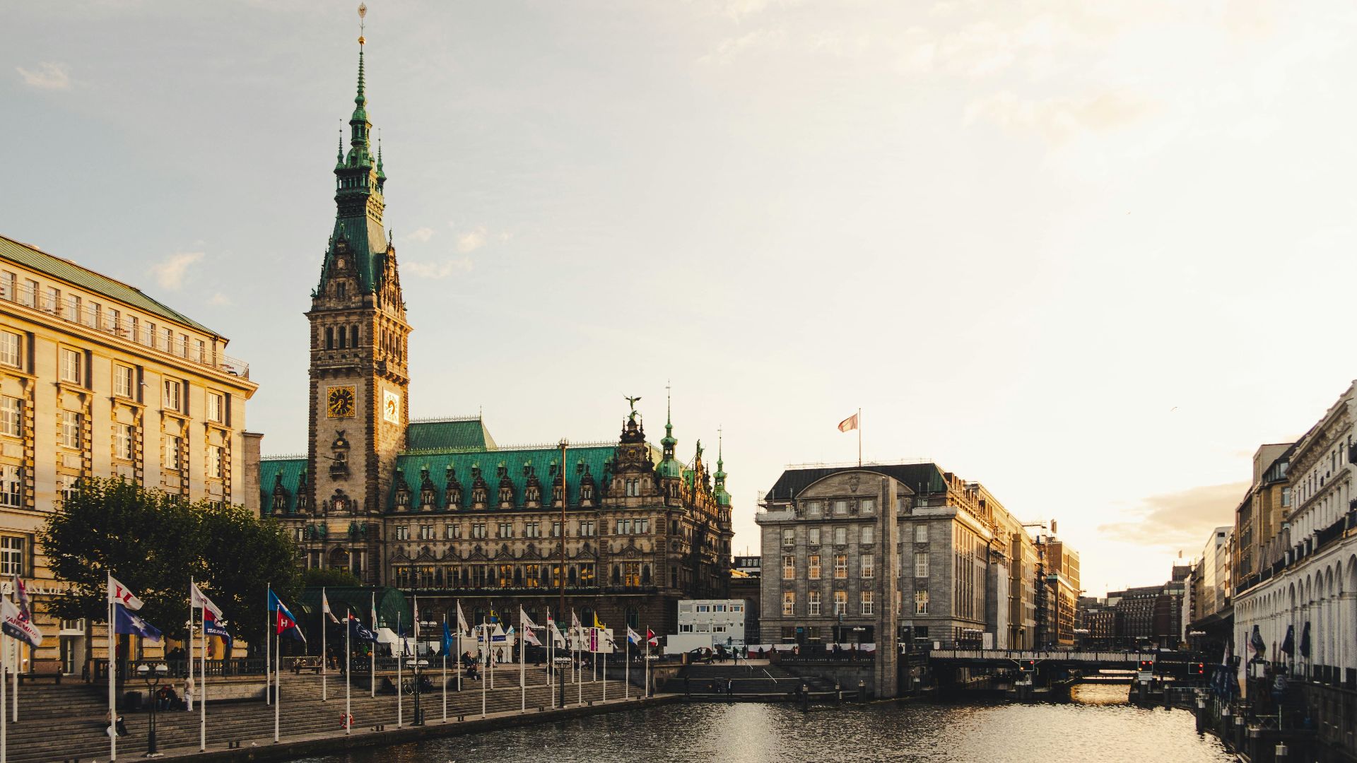 brown concrete buildings beside river