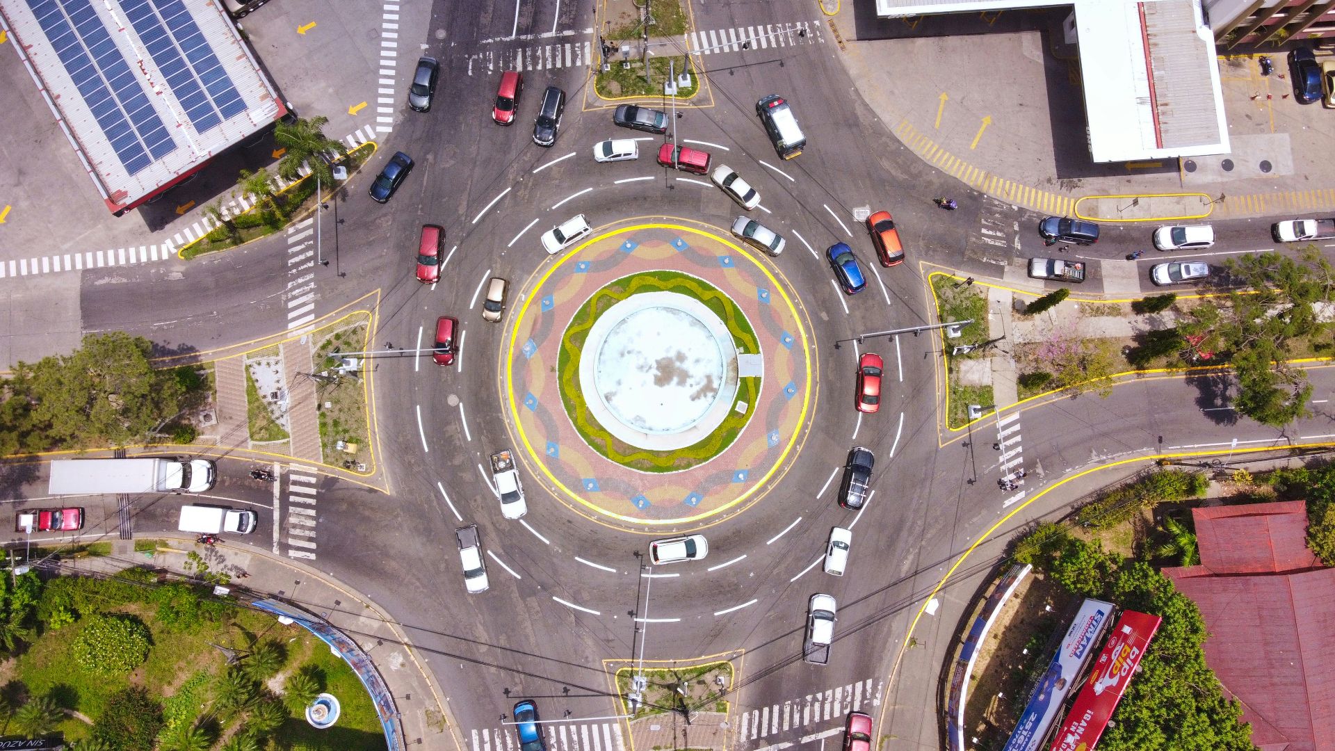 an aerial view of a city intersection with cars