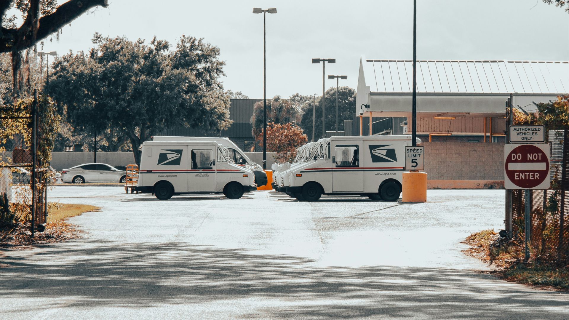 two vans are parked in a parking lot