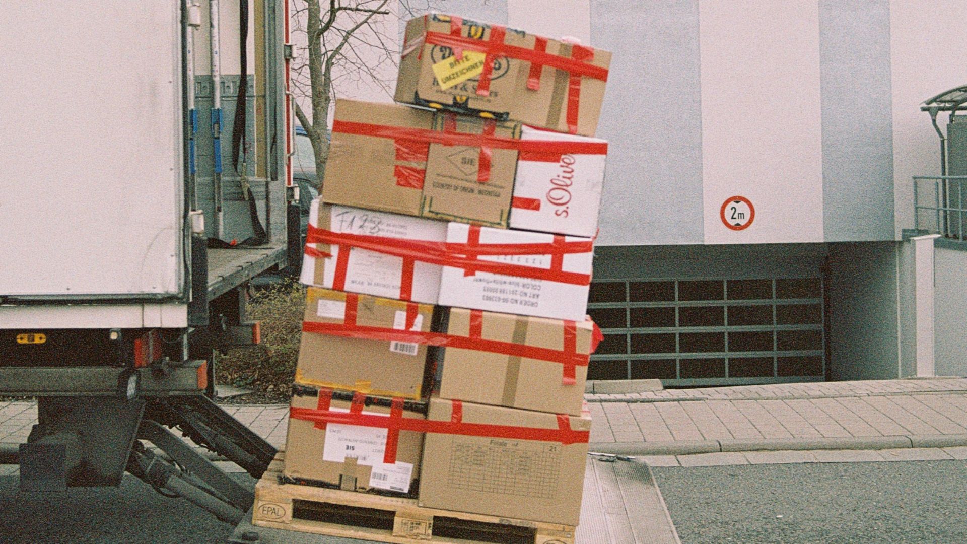 brown cardboard boxes on gray asphalt road
