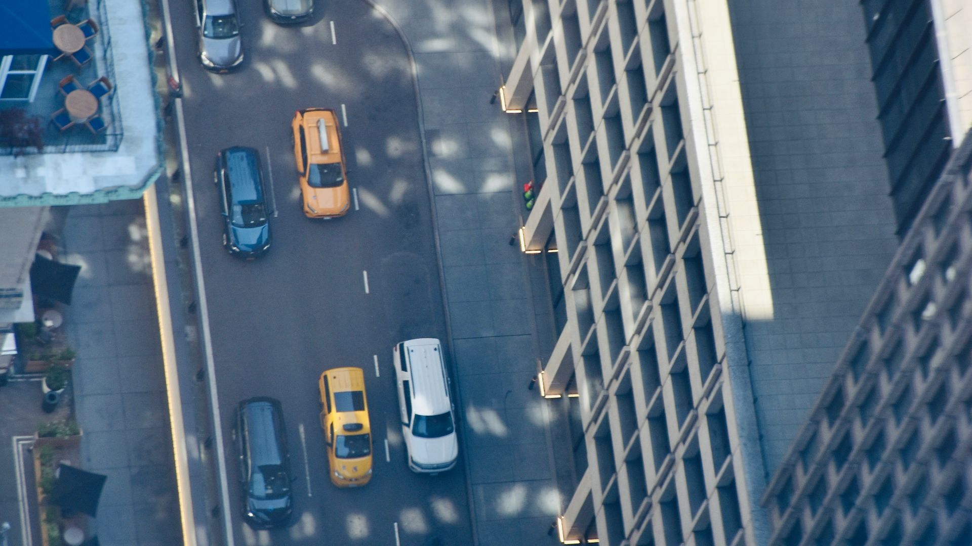 Aerial view of cars driving on a city street.