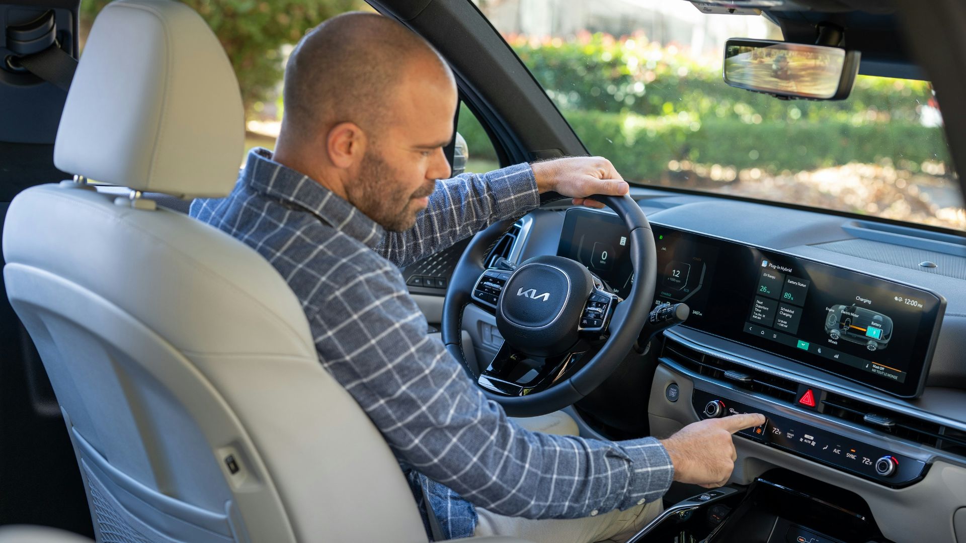 A man sitting in the driver's seat of a car