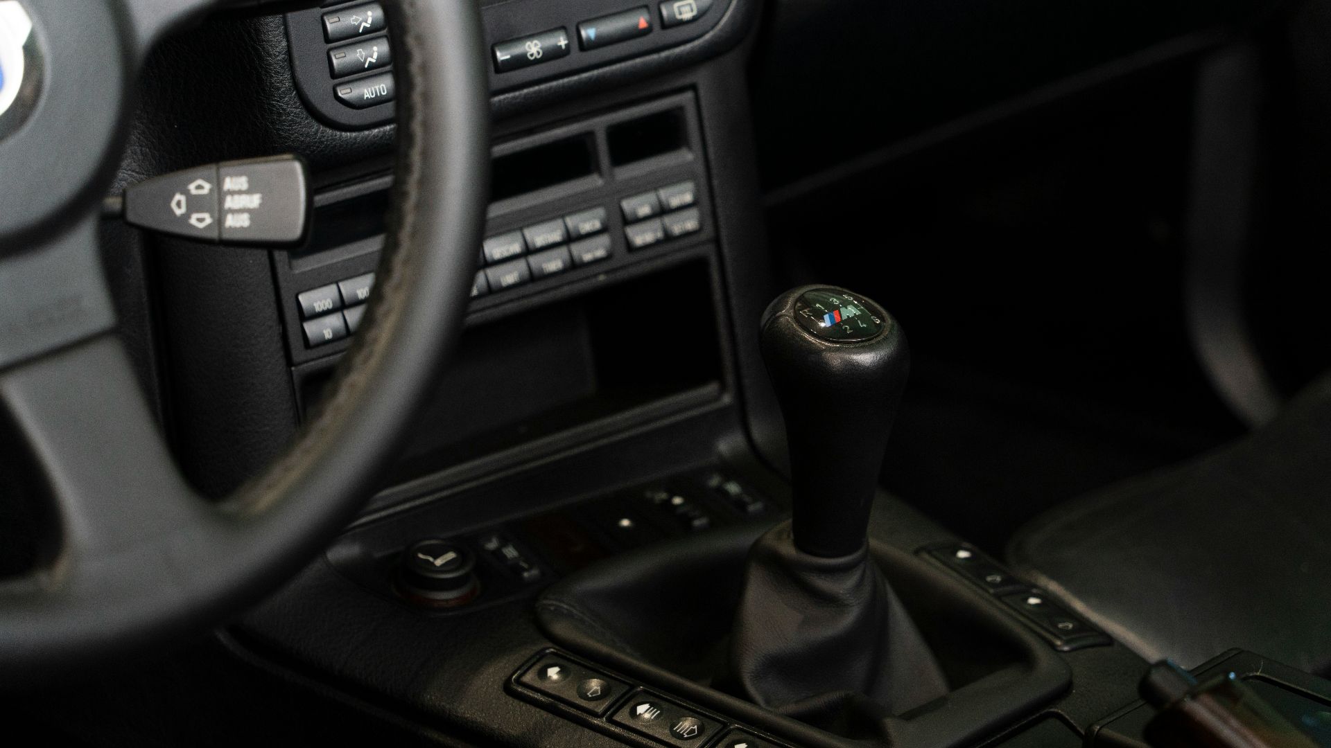 a steering wheel and dashboard of a car