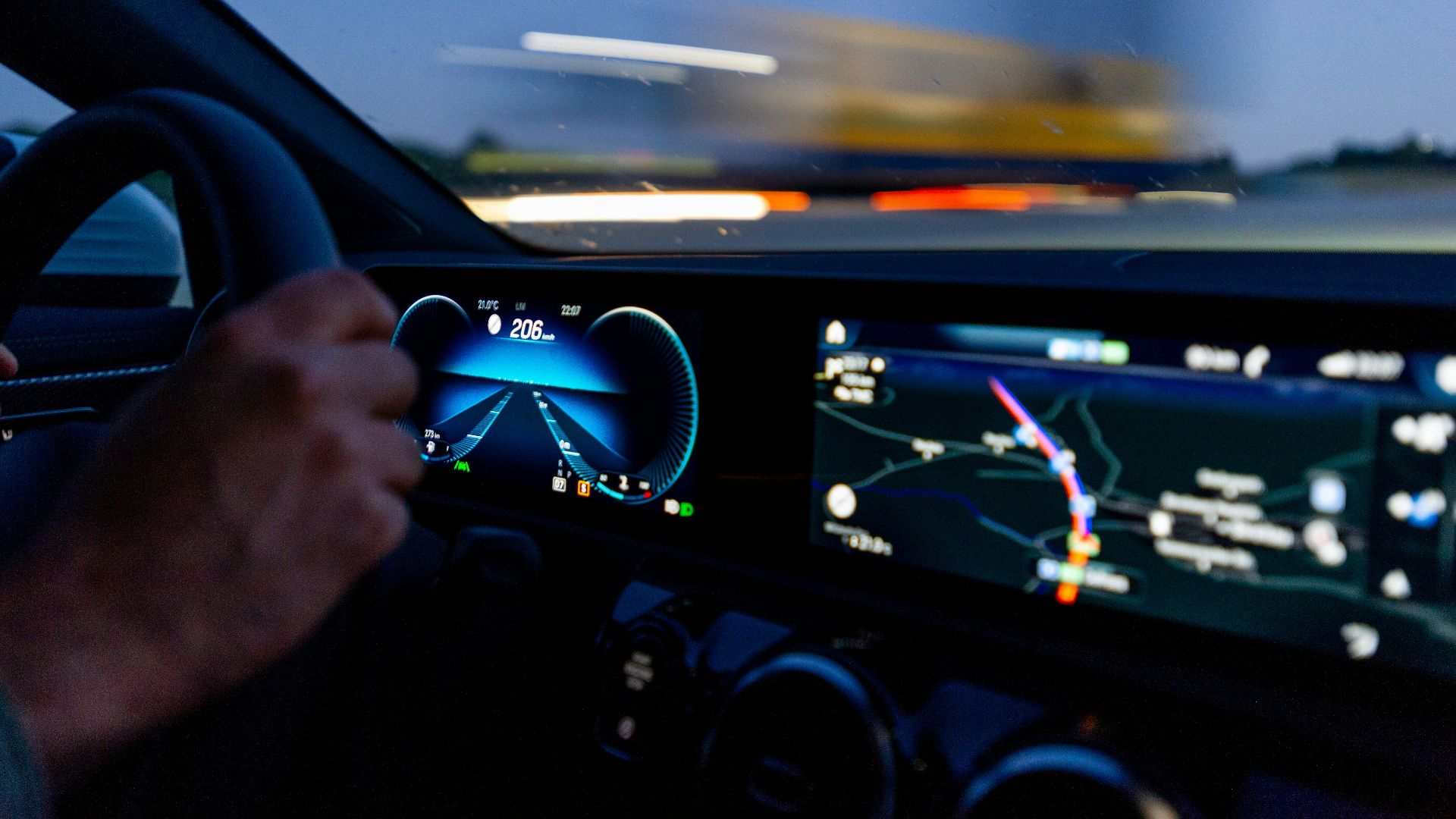 person's hand on steering wheel