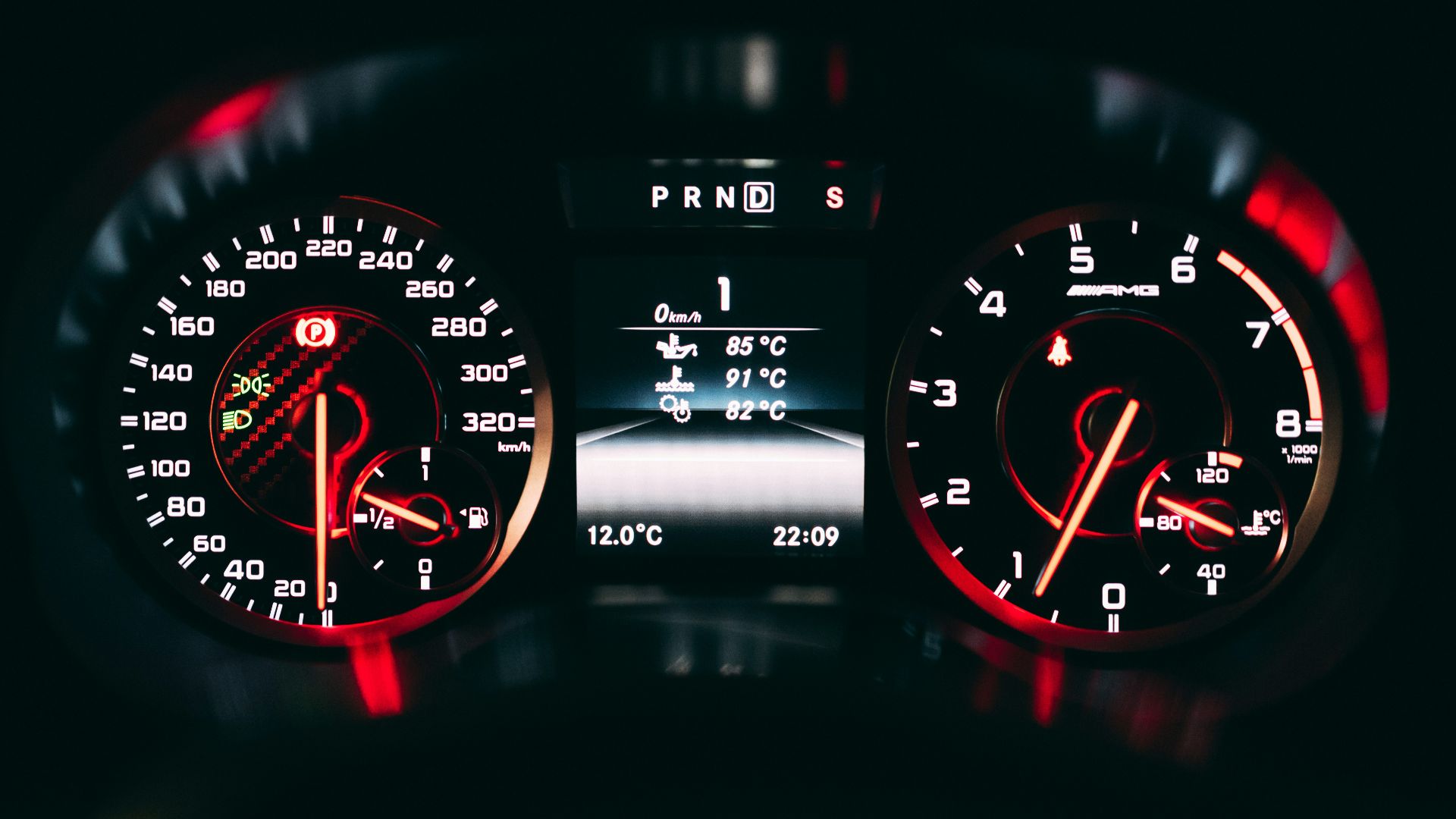 black and red analog speedometer