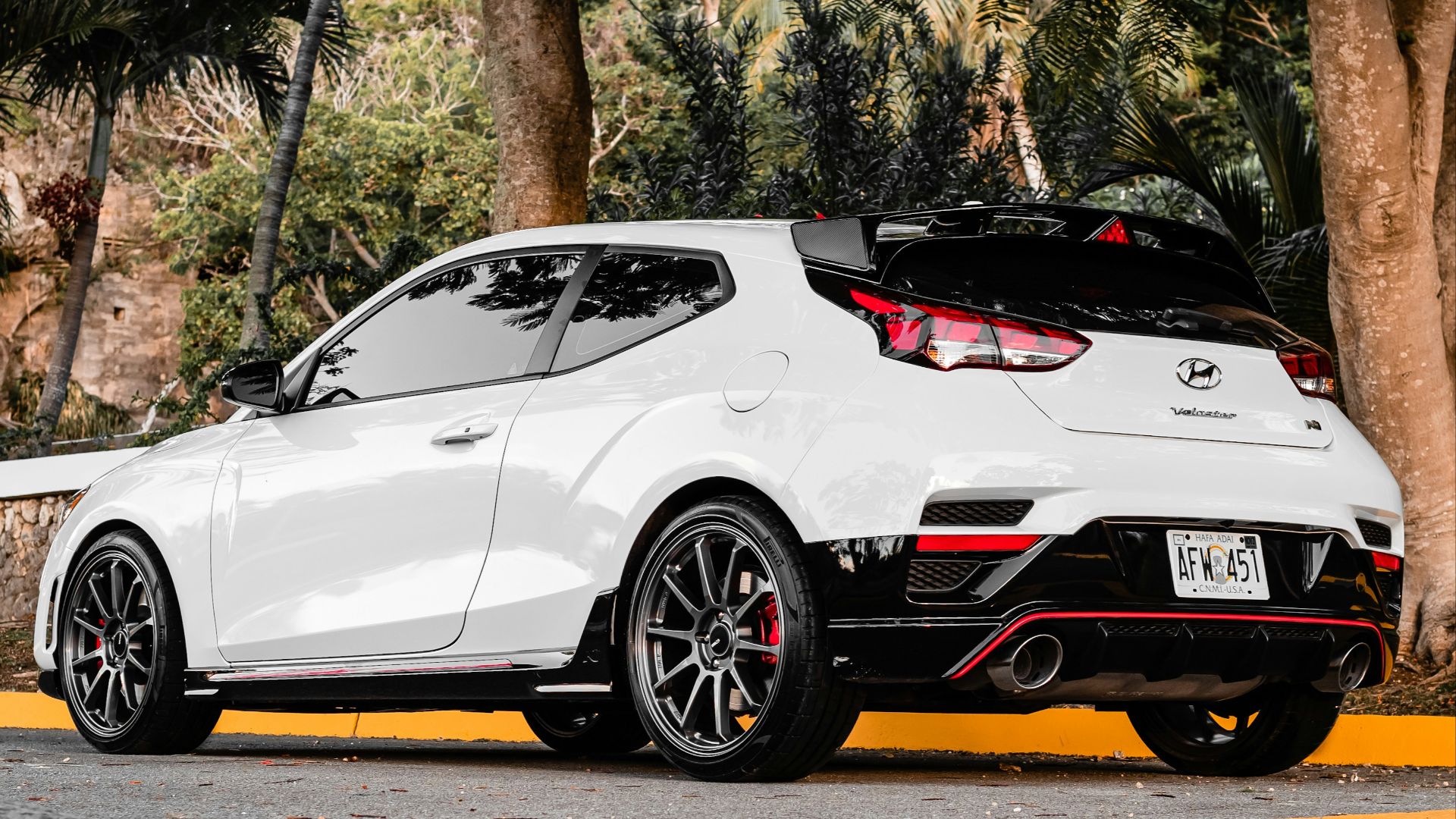 white and red porsche 911 parked on road during daytime