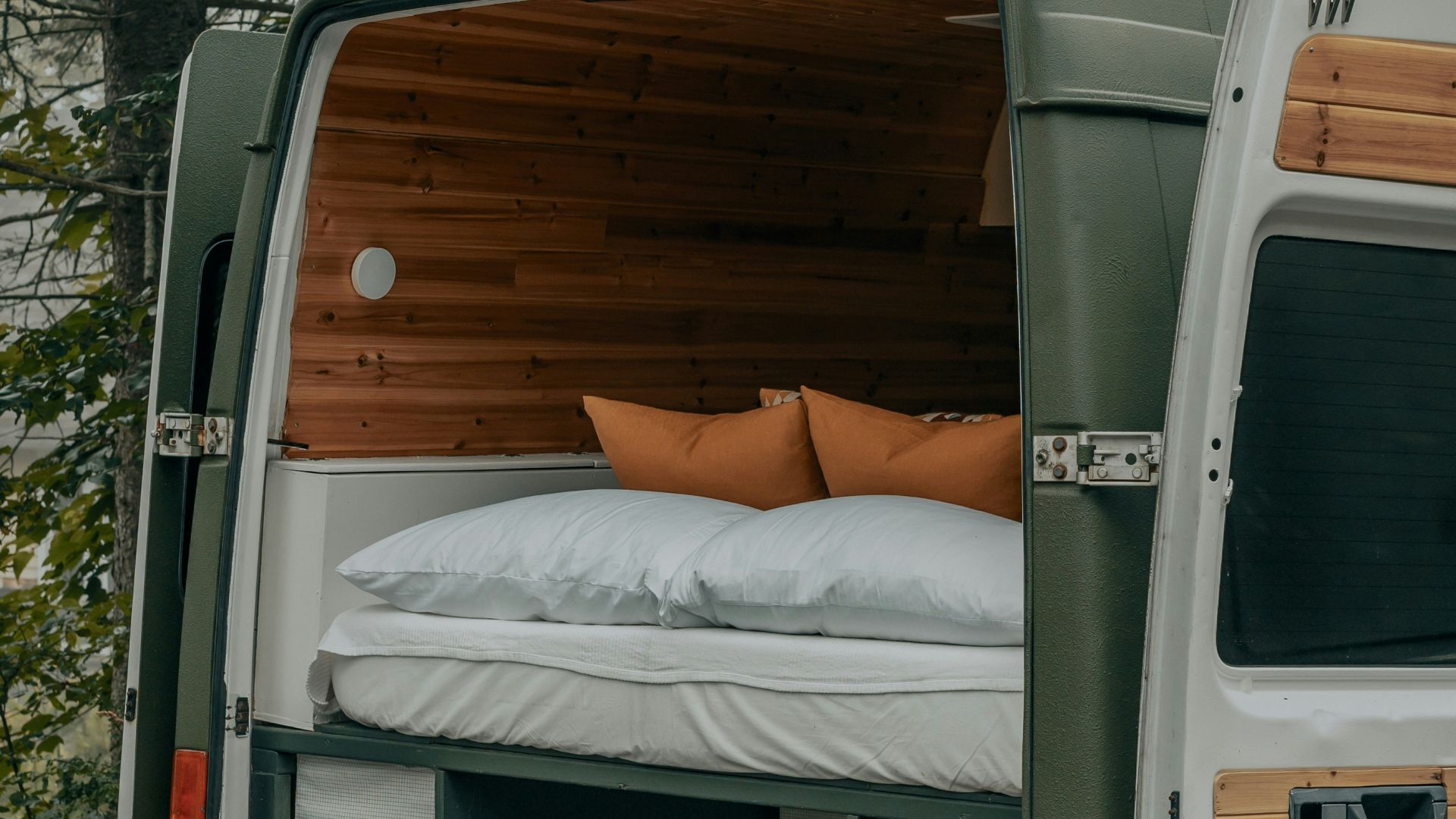 white van with brown wooden door