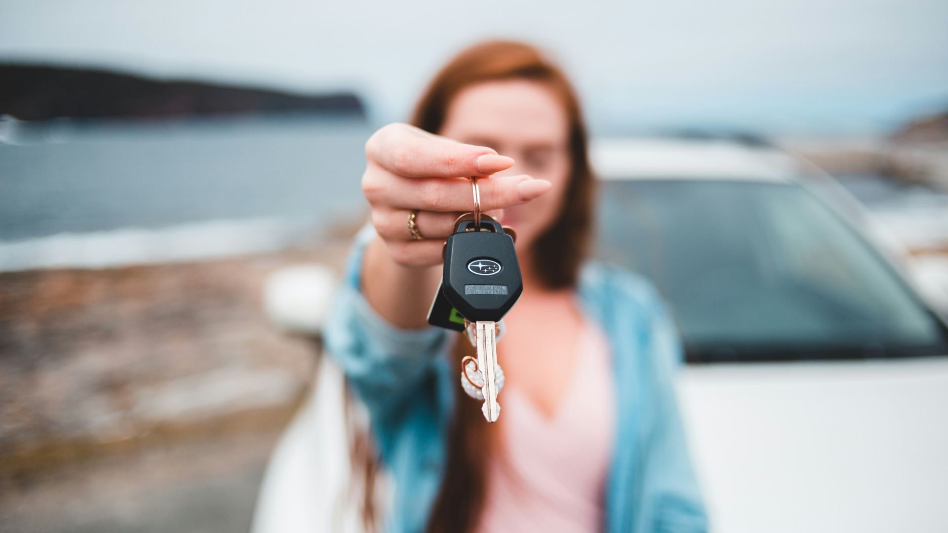 focus photography of black vehicle key