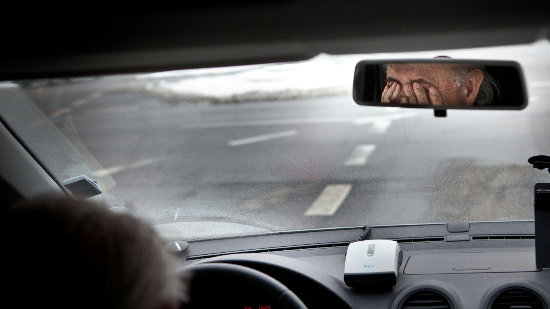 person driving car during daytime