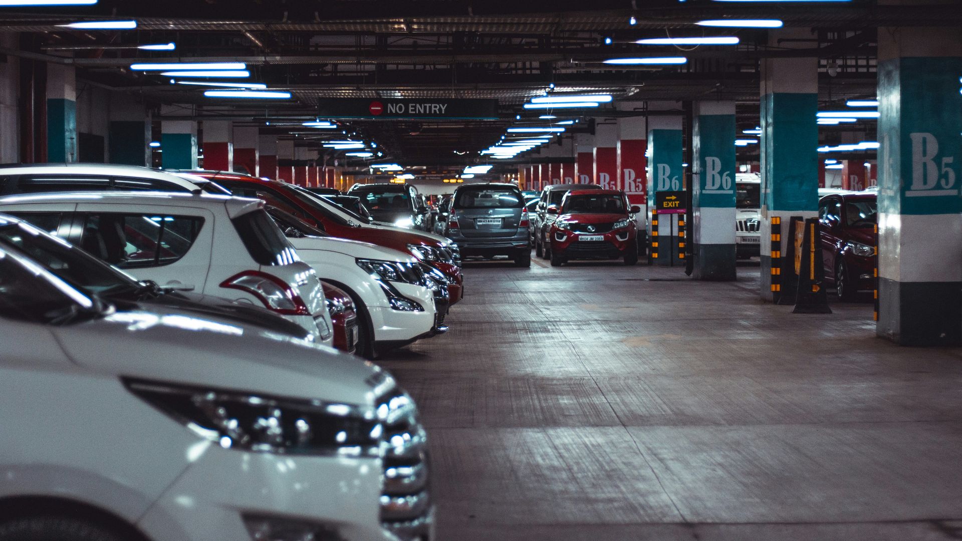 different vehicles parking on garage area of the building
